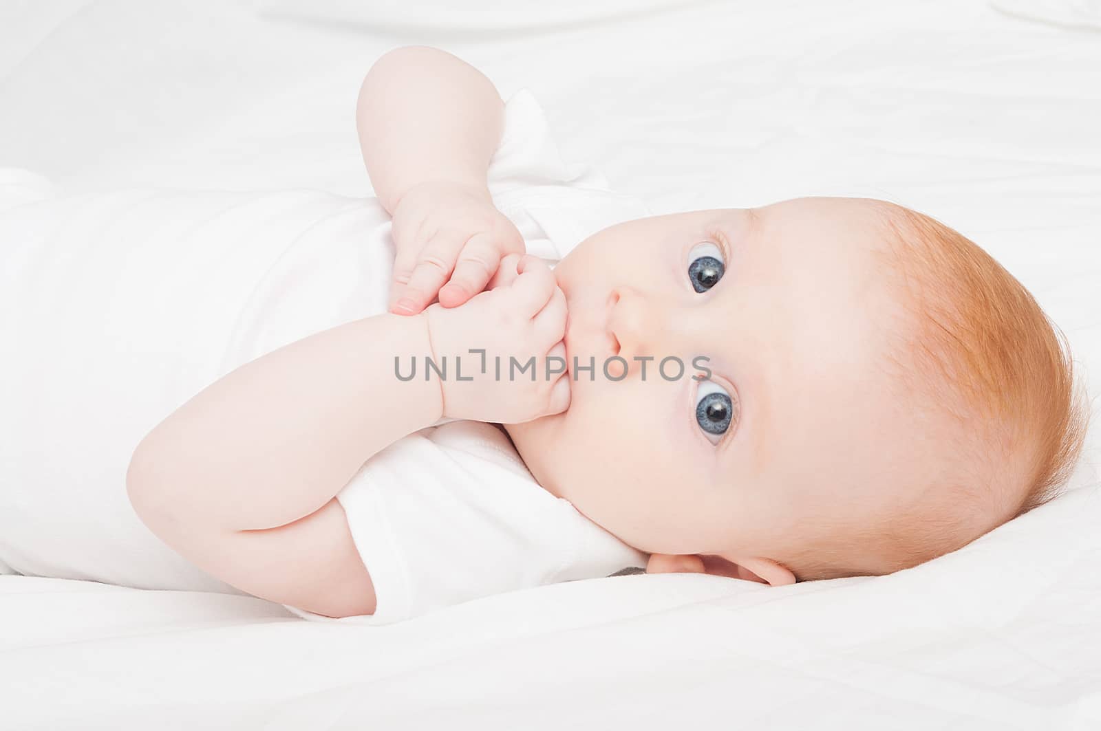 Cute Baby Girl Sucking Her Fingers on White Background
