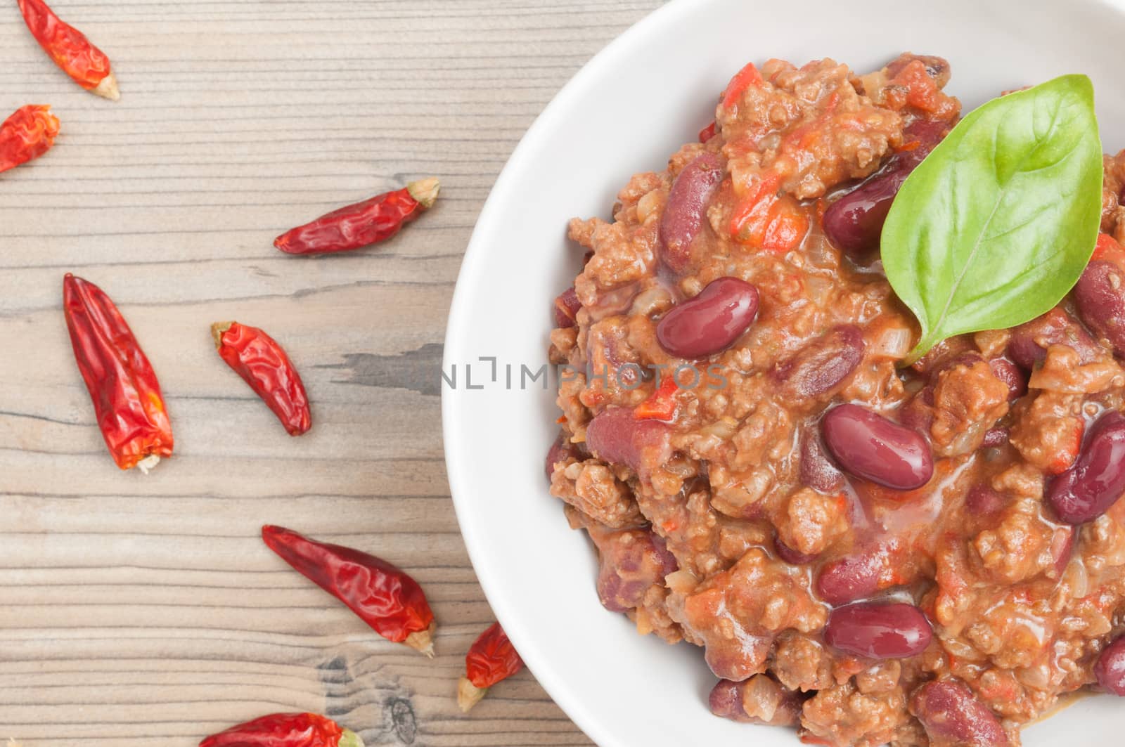 Top View of Chilli Con Carne in White Bowl and Red Chili Pepper