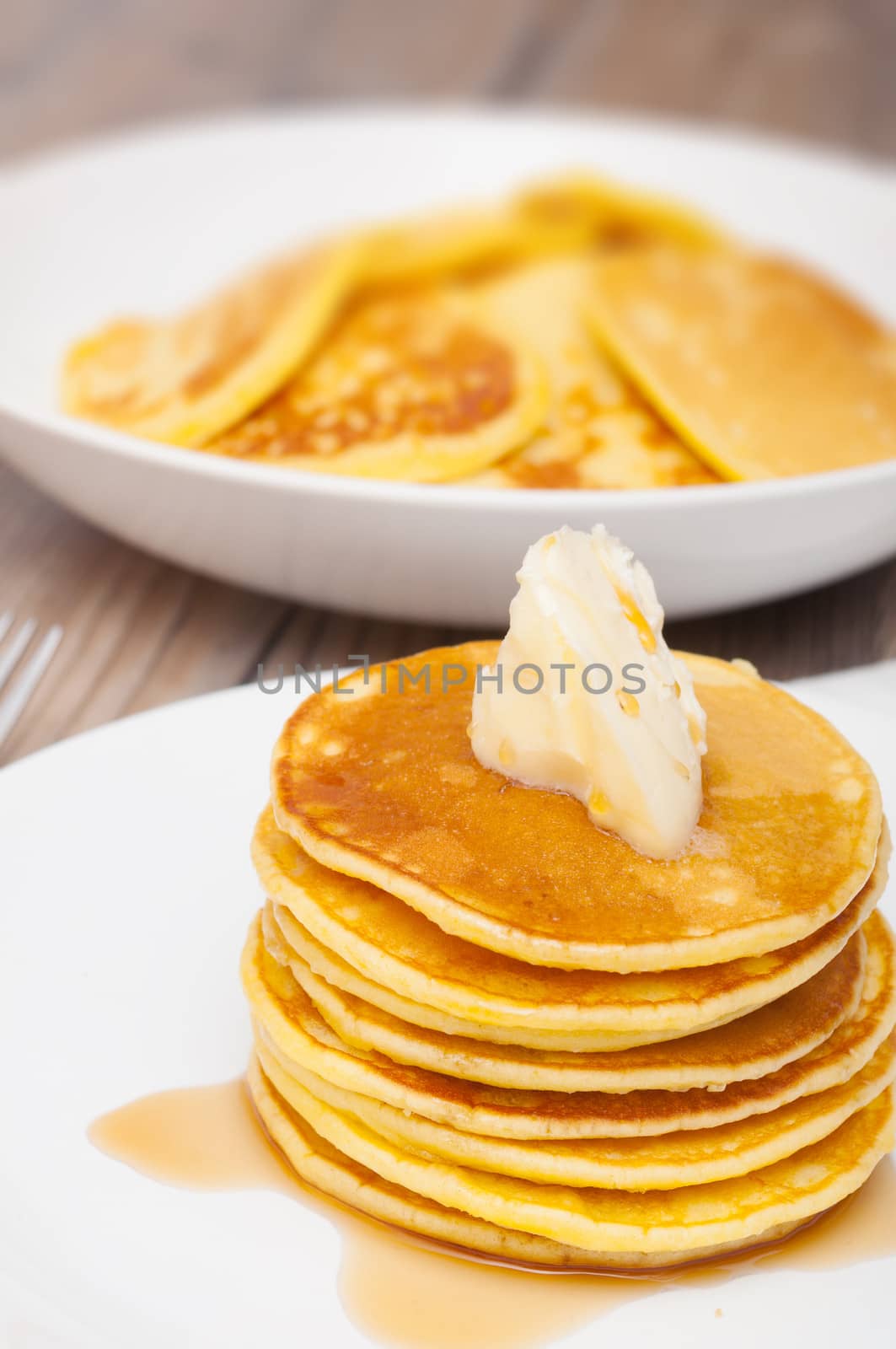 Homemade Pancakes With Butter and Warm Maple Syrup - Shallow Depth of Field