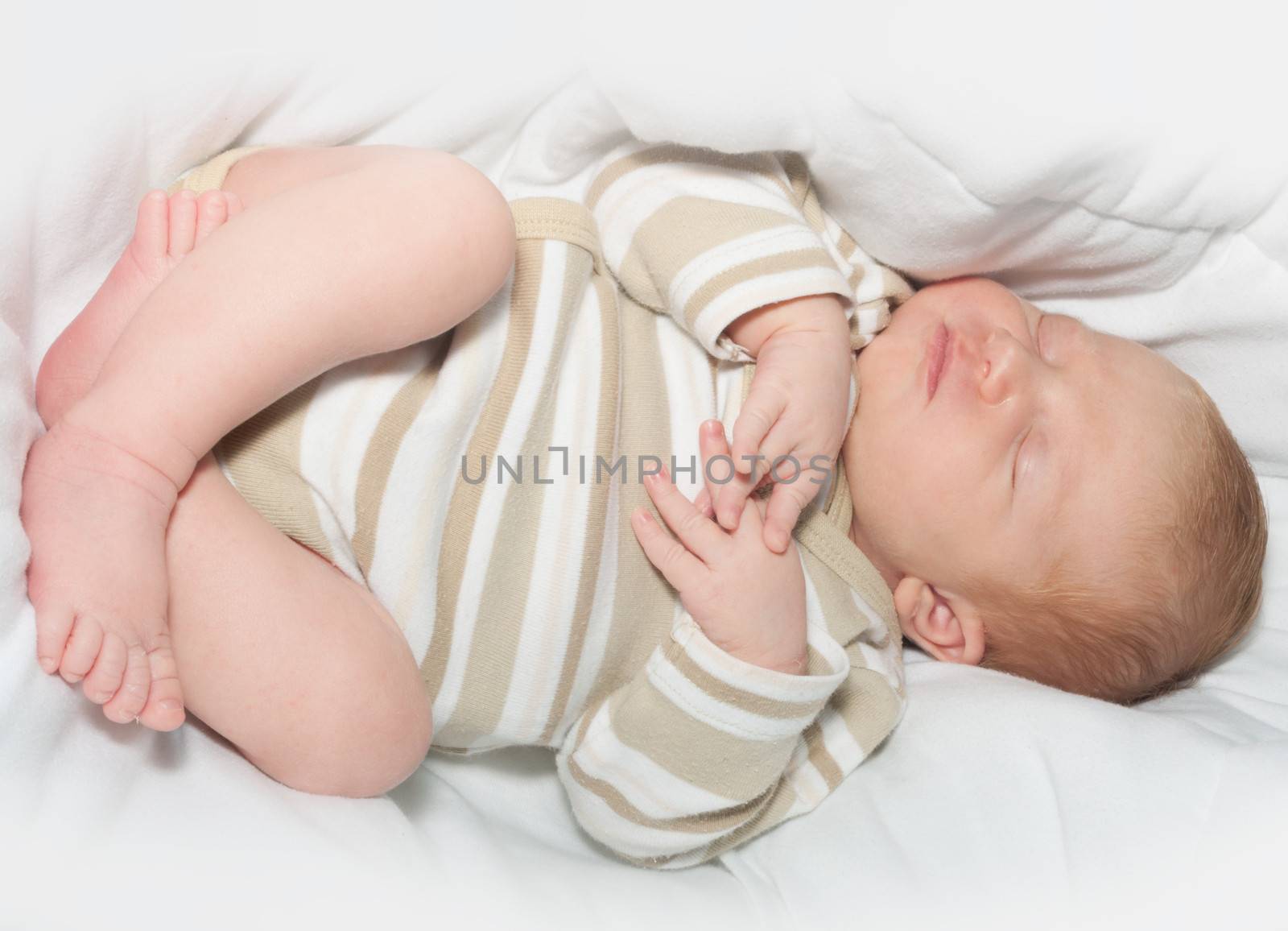 Cute Sleeping Newborn Baby in Bed