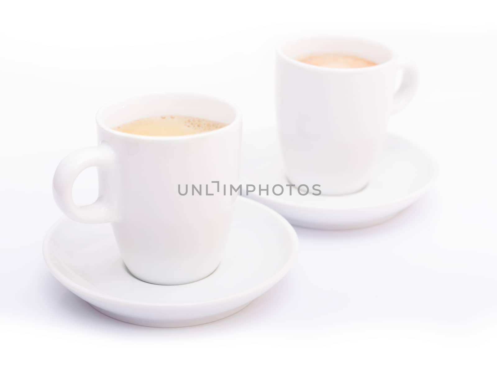 Two White Cups of Espresso Coffee on White Background - Shallow Depth of Field