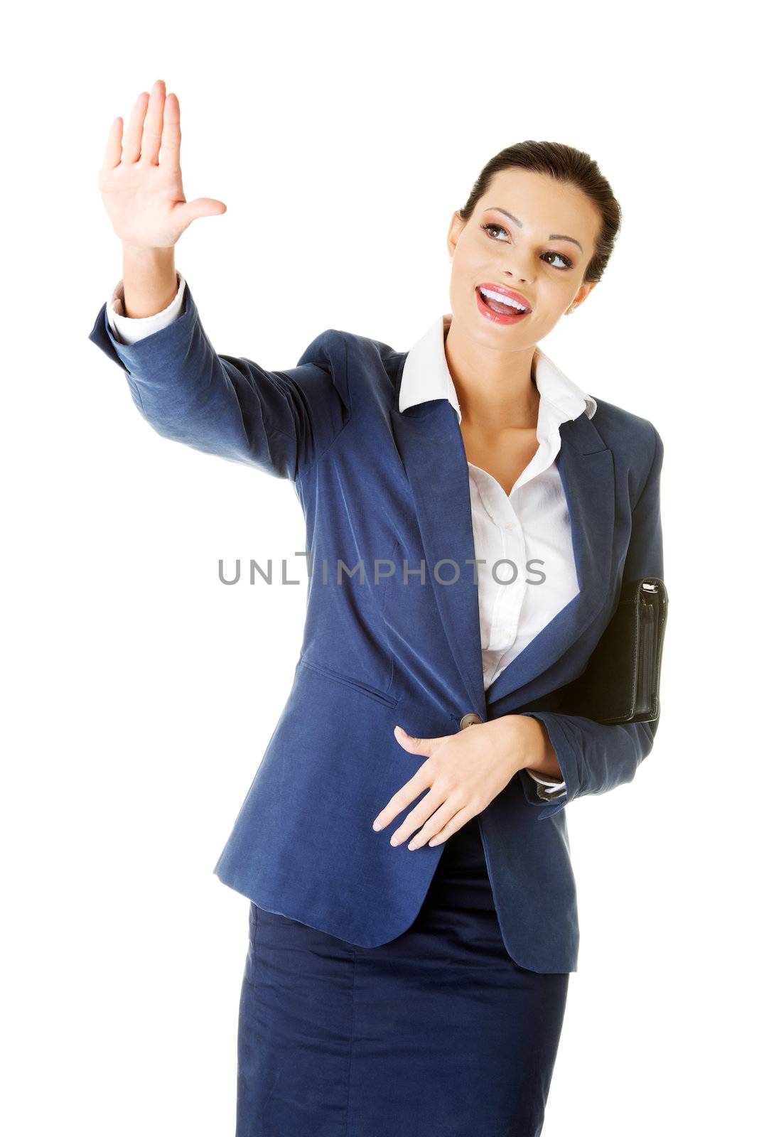 Young beautiful businesswoman making choose on abstract screen