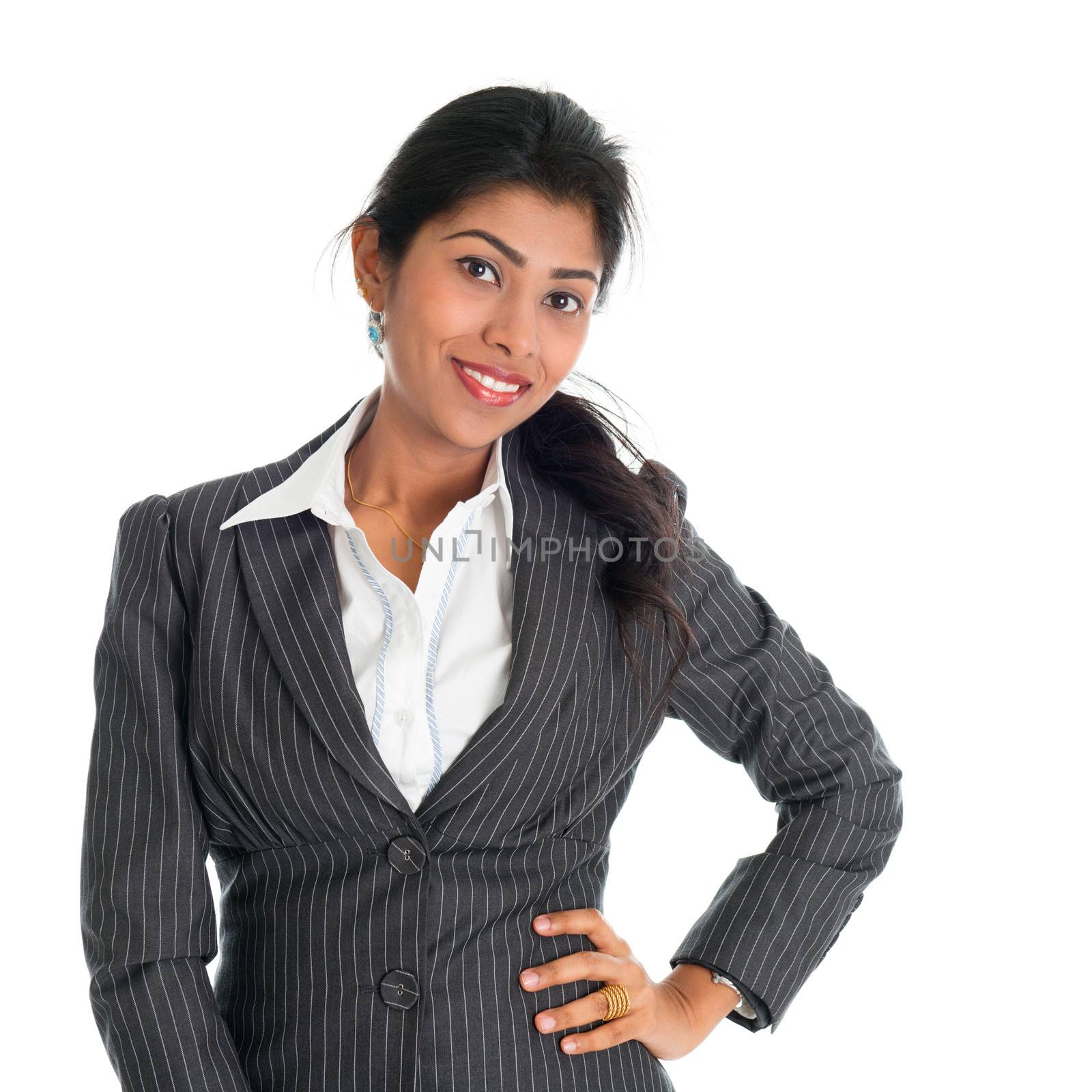 Portrait of attractive African American businesswoman in business suit, isolated over white background. Mixed race Asian Indian and African American model.