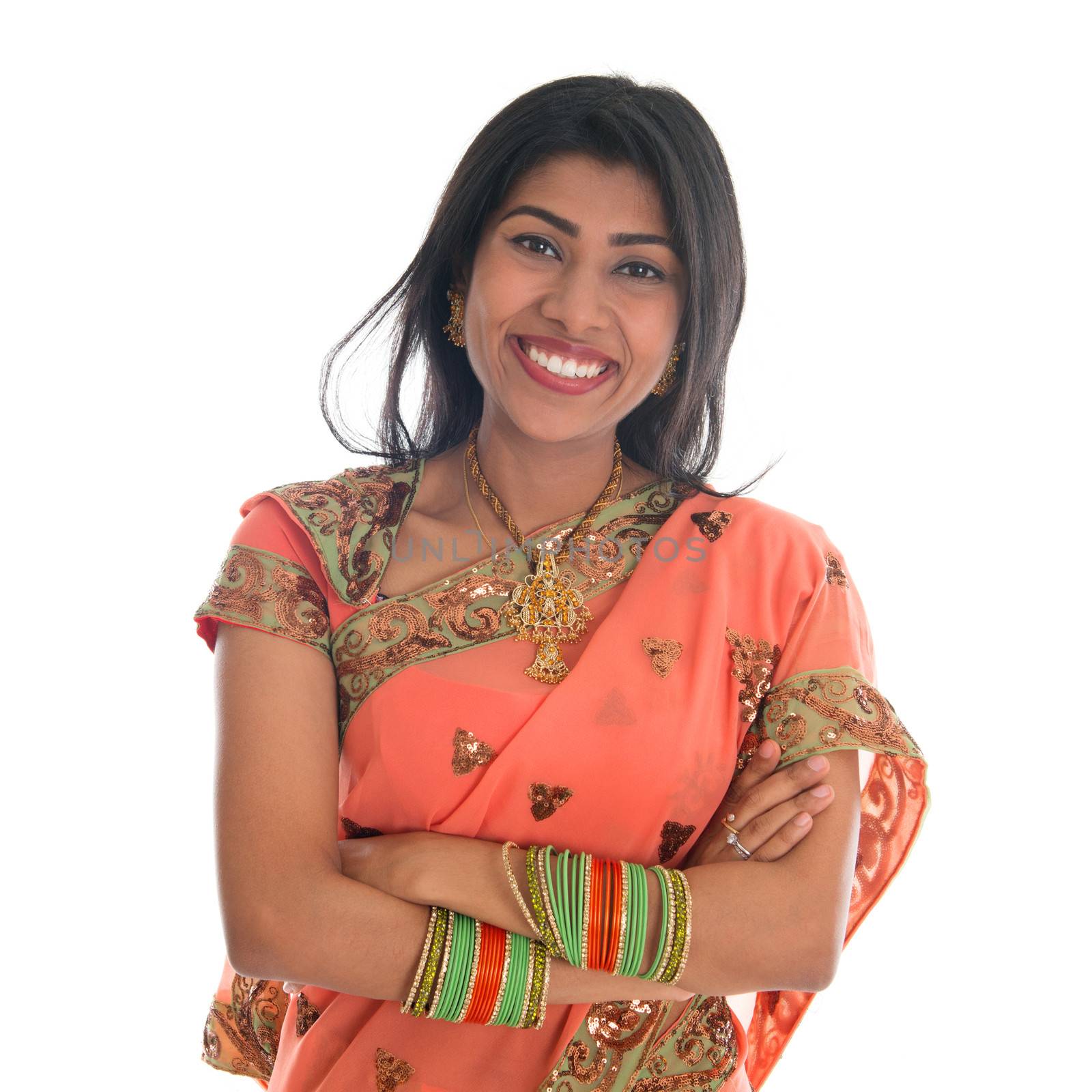 Portrait of beautiful traditional Indian woman in sari dress smiling, isolated over white background. 