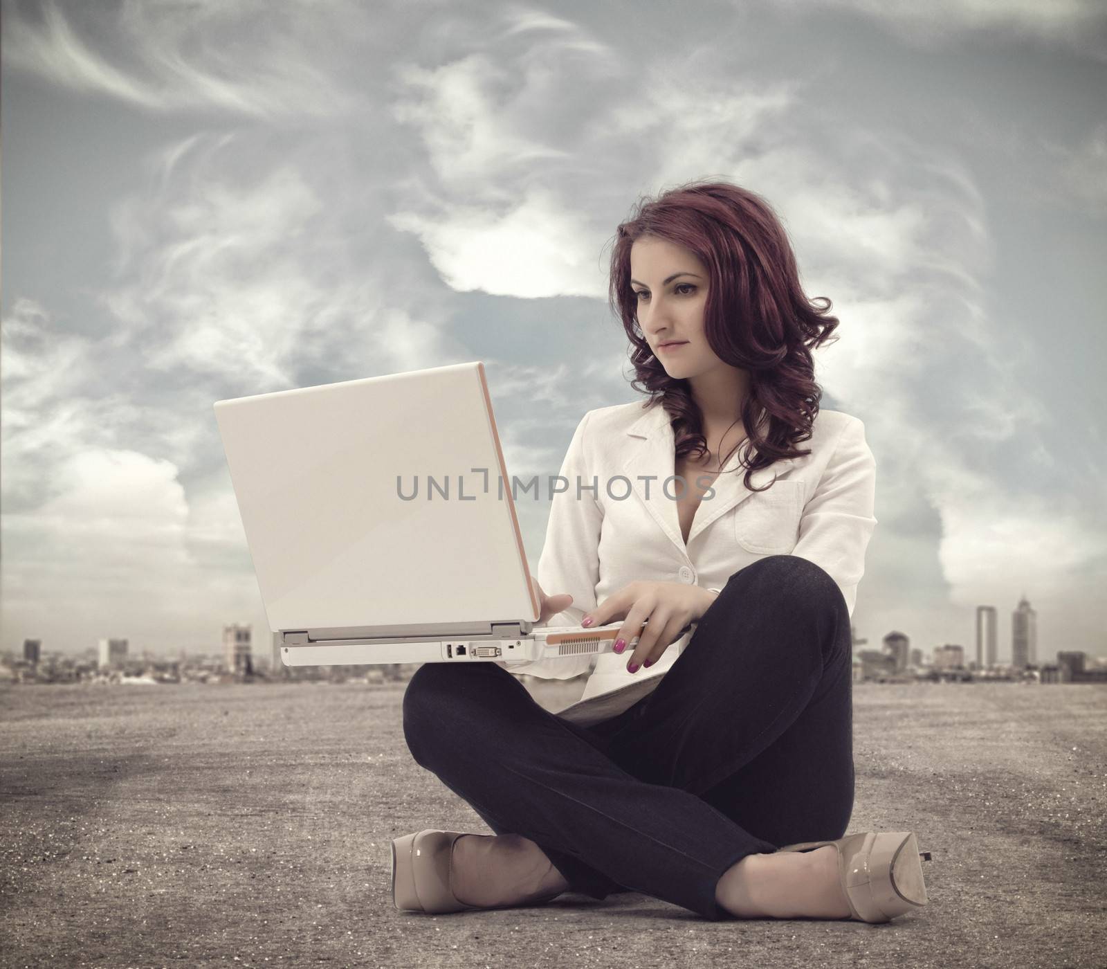 Businesswomen sitting and working with laptop