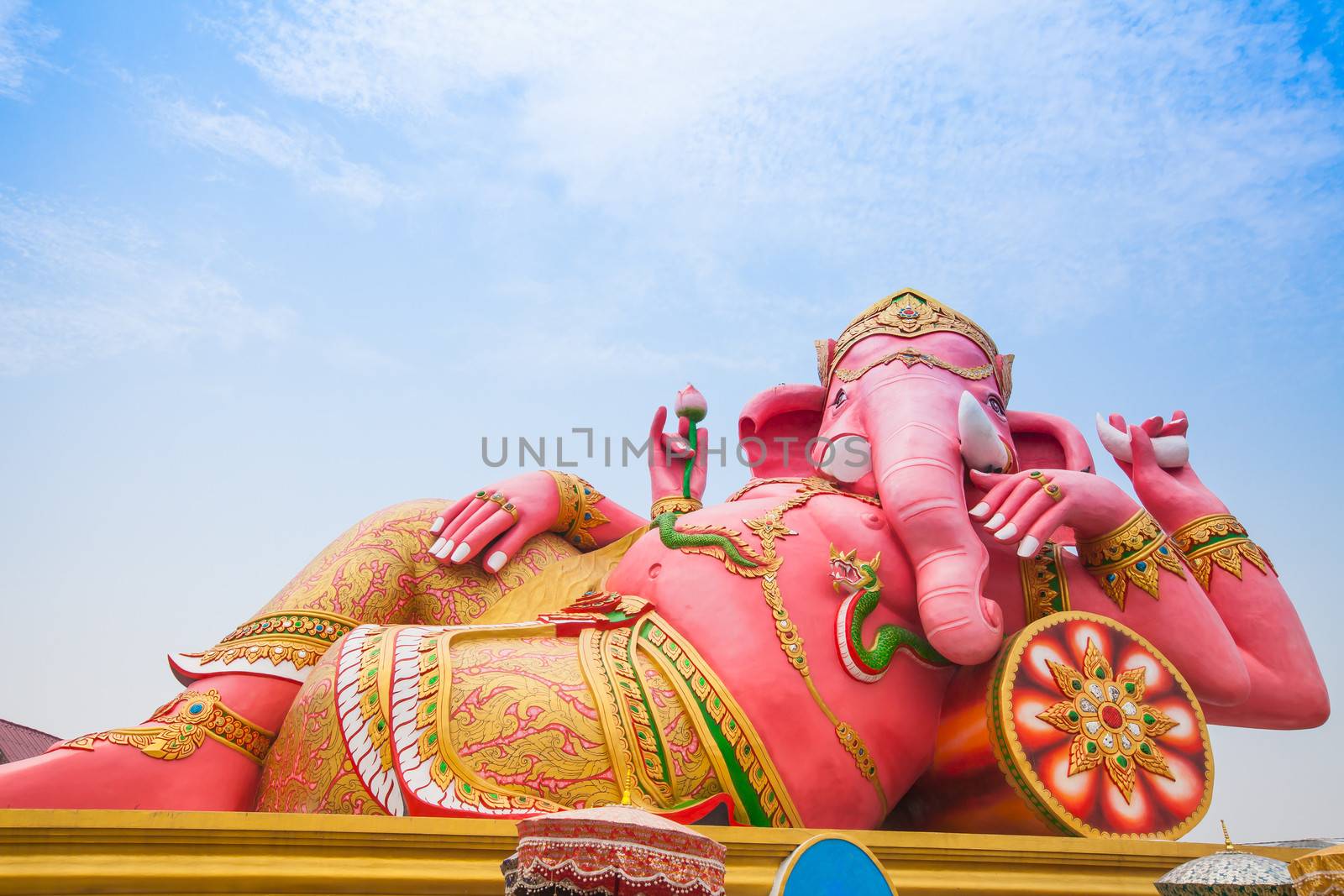 Pink ganesha in relaxing protrait on blue sky, Thailand.