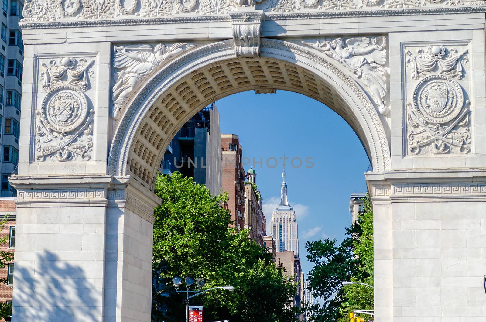 Washington Square Arch and the Empire State Building in the dist by marcorubino