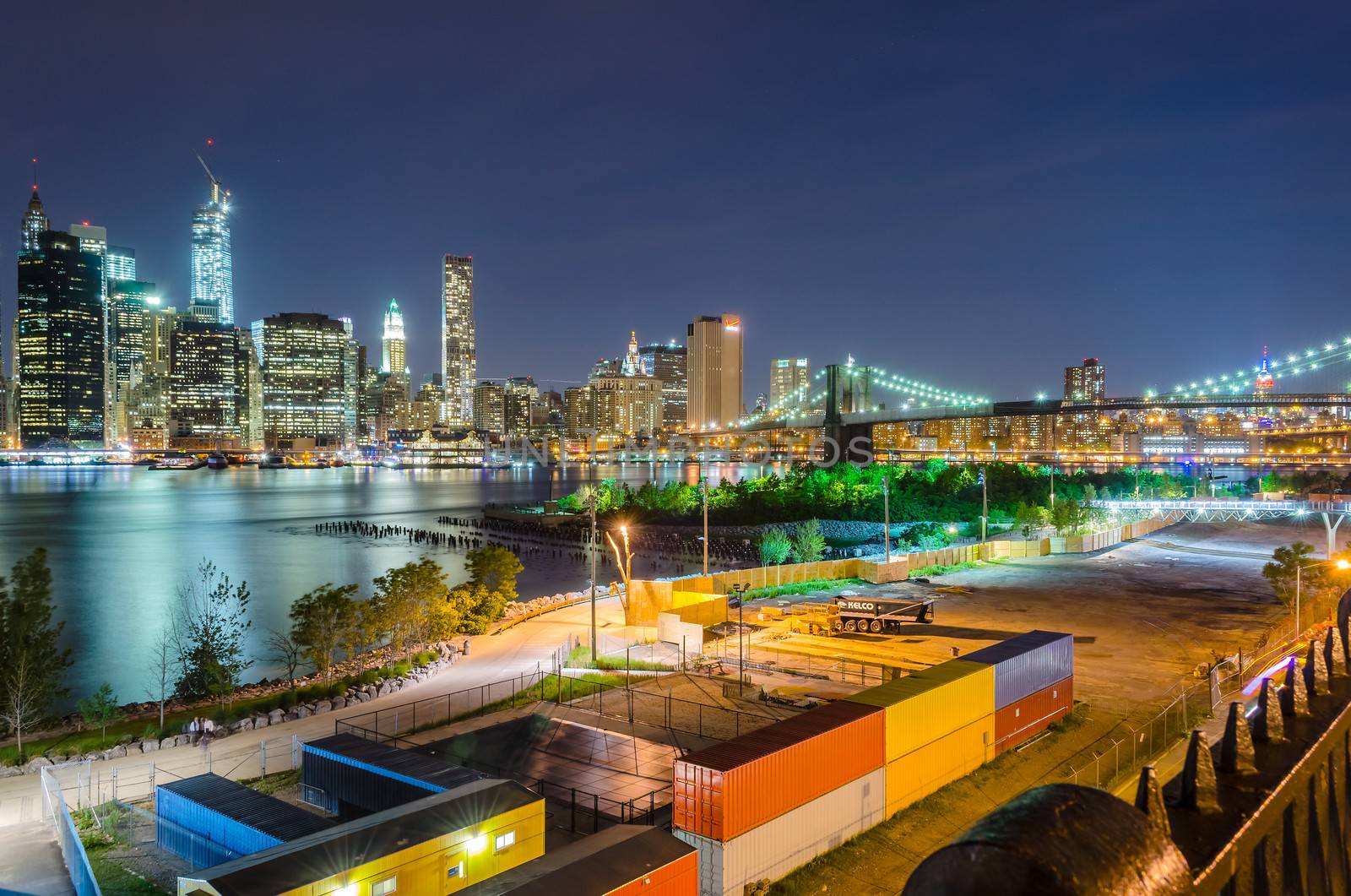 Manhattan Skyline and Brooklyn Bridge at Night by marcorubino