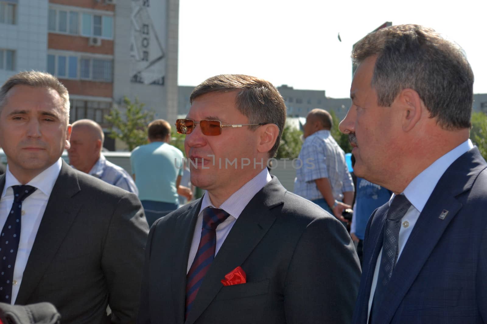 the mayor of Tyumen Alexander Moor, the governor of the Tyumen region Vladimir Yakushev and the director general of JSC Mostostroy-11 Nikolay Russu at opening of a new traffic intersection on Melnikayte St., Tyumen. 22.08.2013