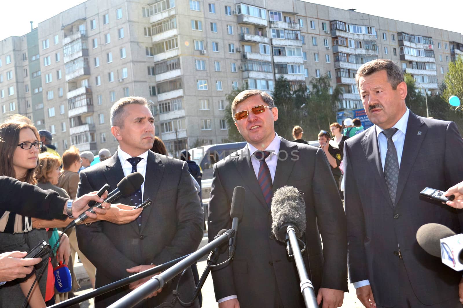 the mayor of Tyumen Alexander Moor, the governor of the Tyumen region Vladimir Yakushev and the director general of JSC Mostostroy-11 Nikolay Russu at opening of a new traffic intersection on Melnikayte St., Tyumen. 22.08.2013