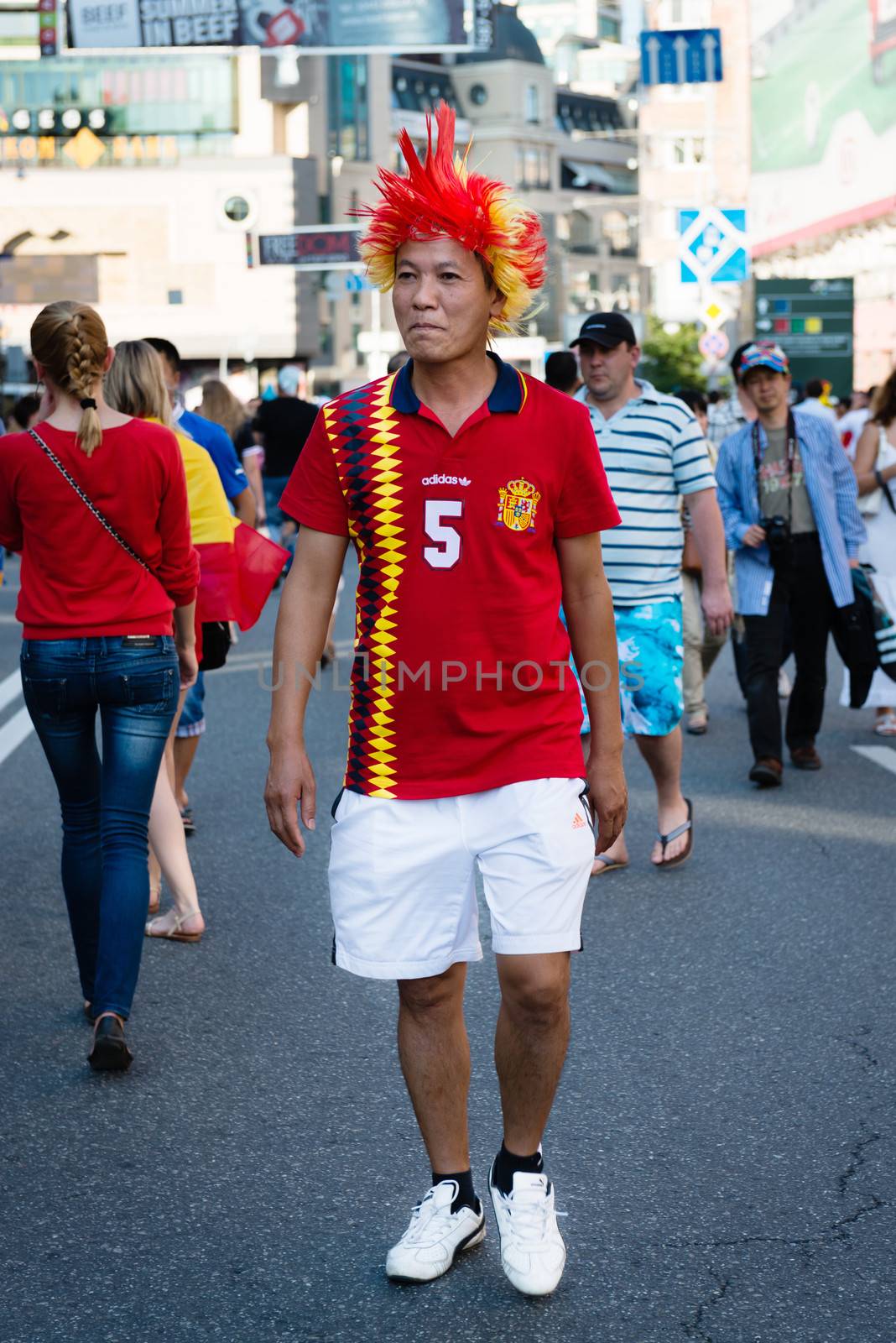 KIEV, UKRAINE - JUL 1: Spanish football fan goes to EURO 2012 final match Spain vs. Italy on July 1, 2012 in Kiev, Ukraine