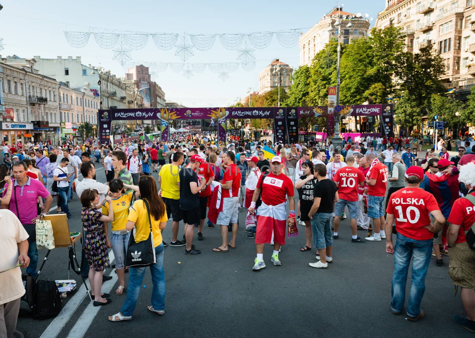 KIEV, UKRAINE - JUL 1: Football fans walk on the central fun zone before EURO 2012 final match Spain vs. Italy on July 1, 2012 in Kiev, Ukraine