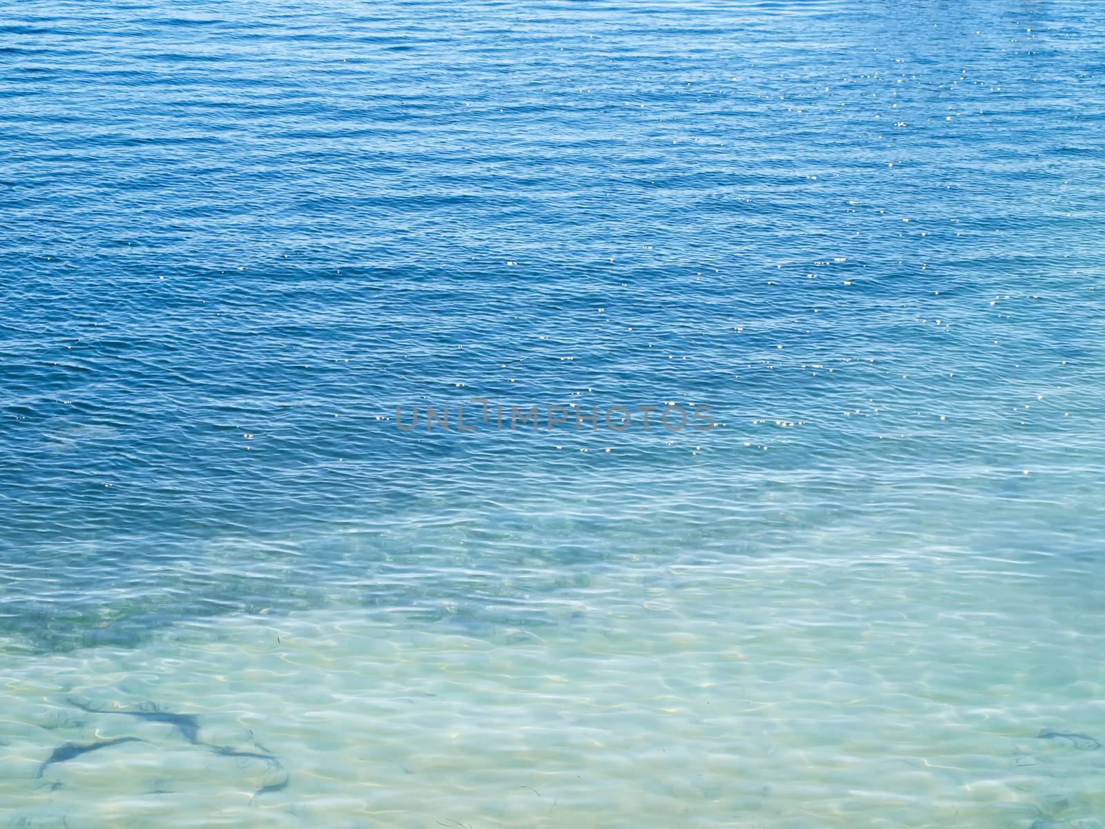 light blue and dark blue colors on sea surface 