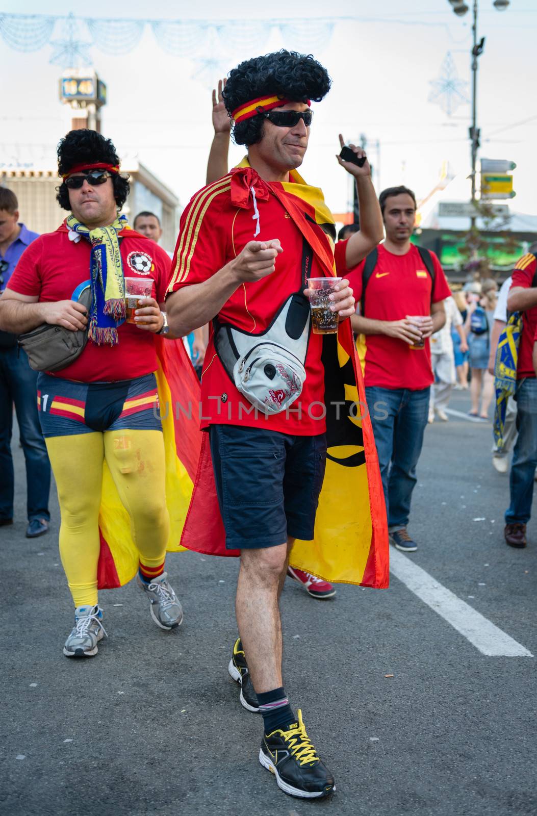 KIEV, UKRAINE - JUL 1: Spanish football fan goes to EURO 2012 final match Spain vs. Italy on July 1, 2012 in Kiev, Ukraine