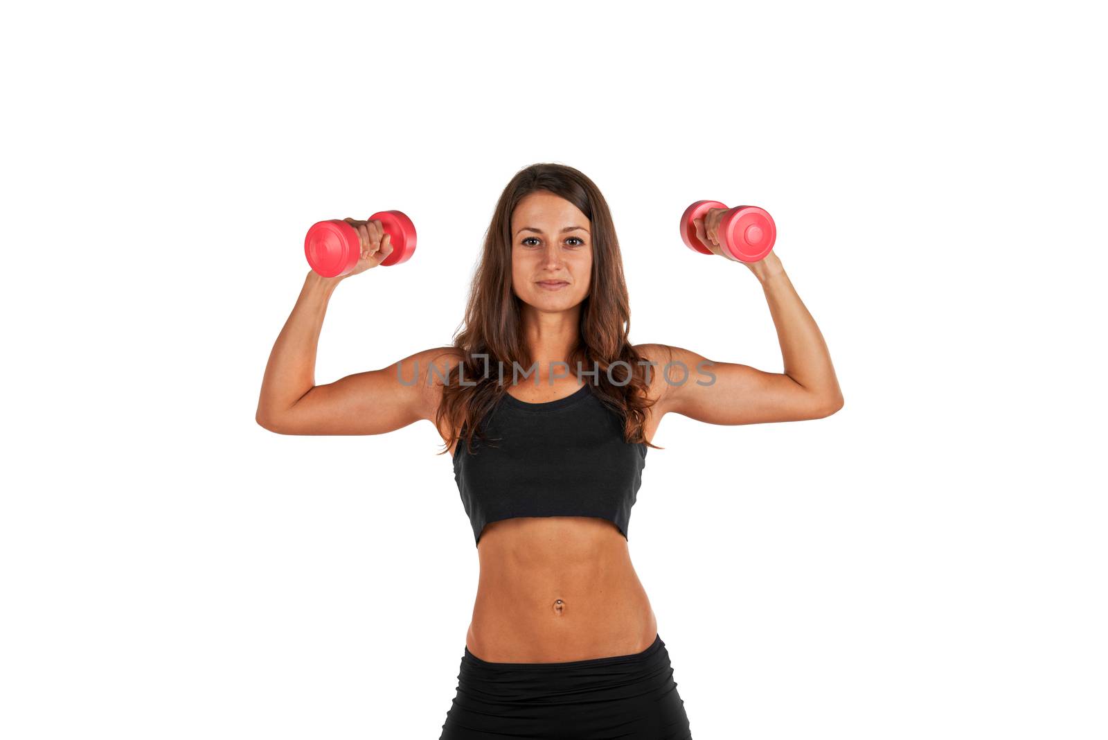 Young woman in the studio with weights working out