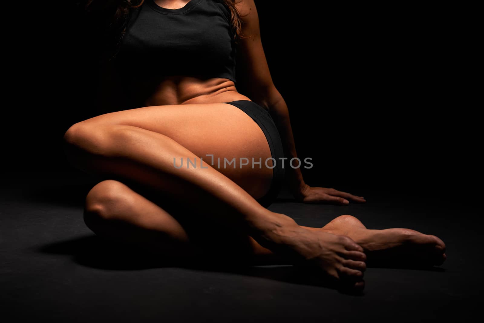 Legs of a beautiful woman in a studio