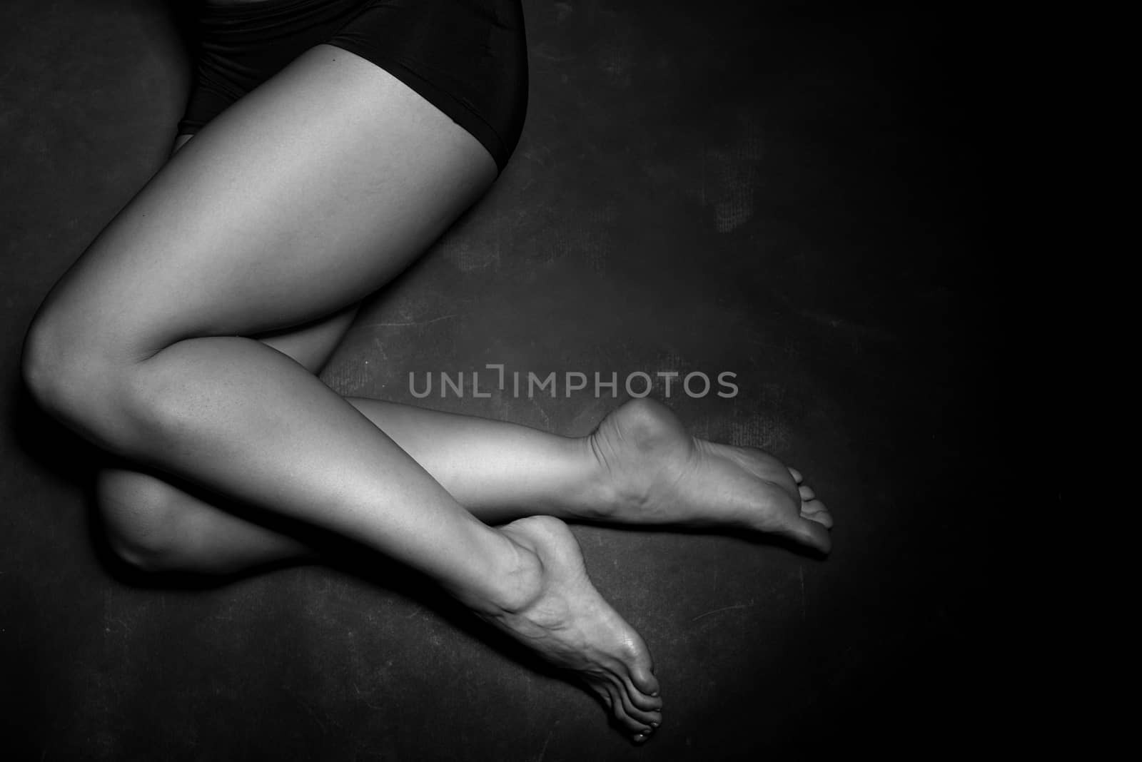 Legs of a beautiful woman in a studio