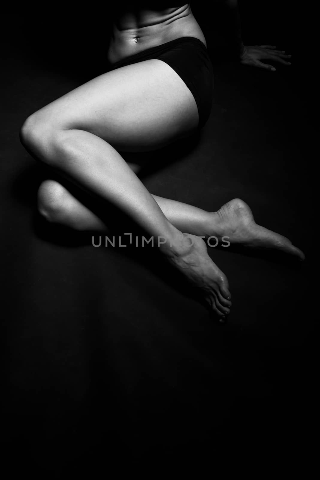 Legs of a beautiful woman in a studio