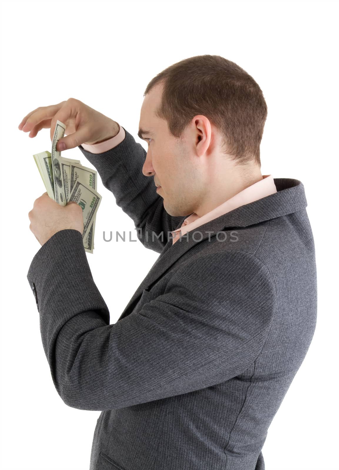 man pulls out a banknote out of the pack on a white background