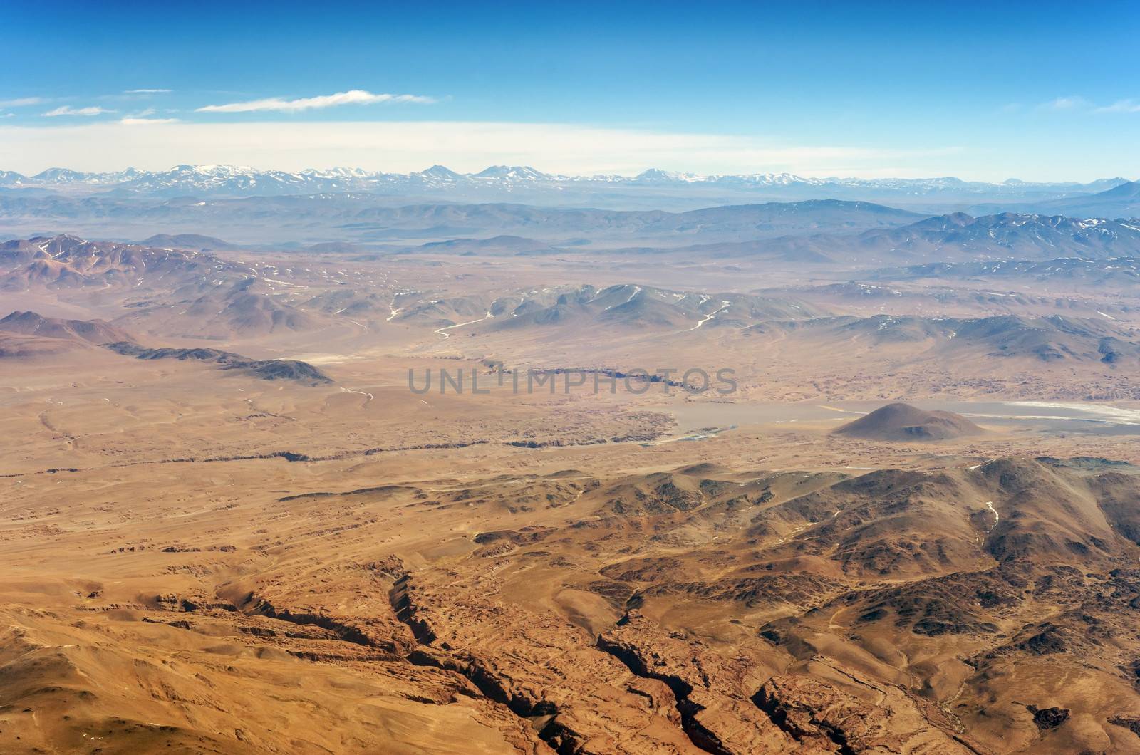 Aerial view of dry desert and the Andes Mountains somewhere over South America