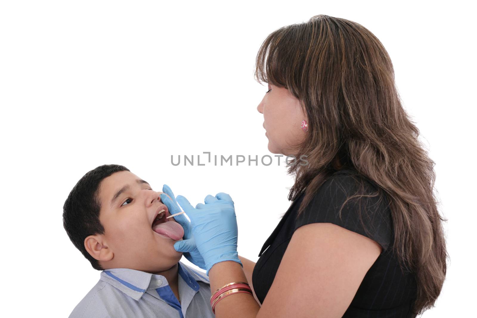 Child at the physician checking his throat by dacasdo