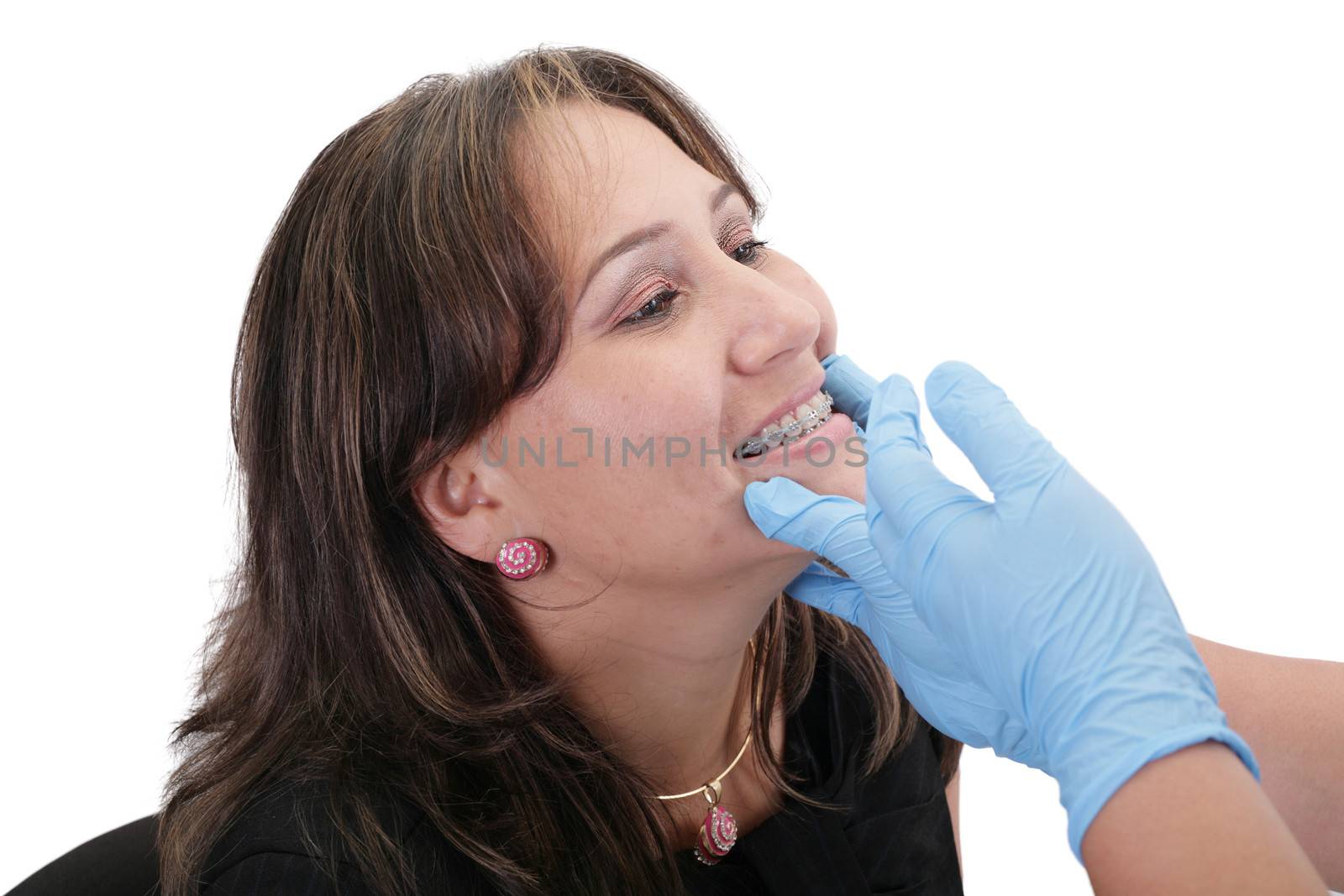 Female patient looking treating at her dentist by dacasdo