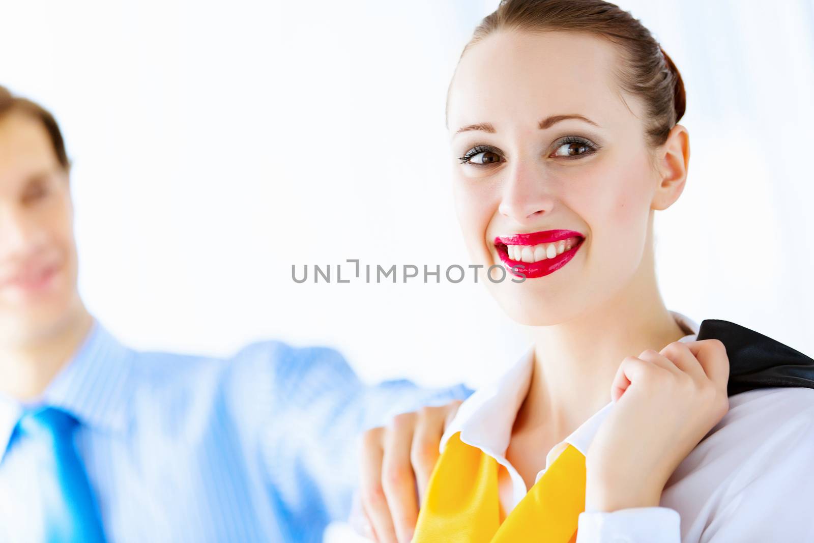 Image of businessman and businesswoman smiling joyfully