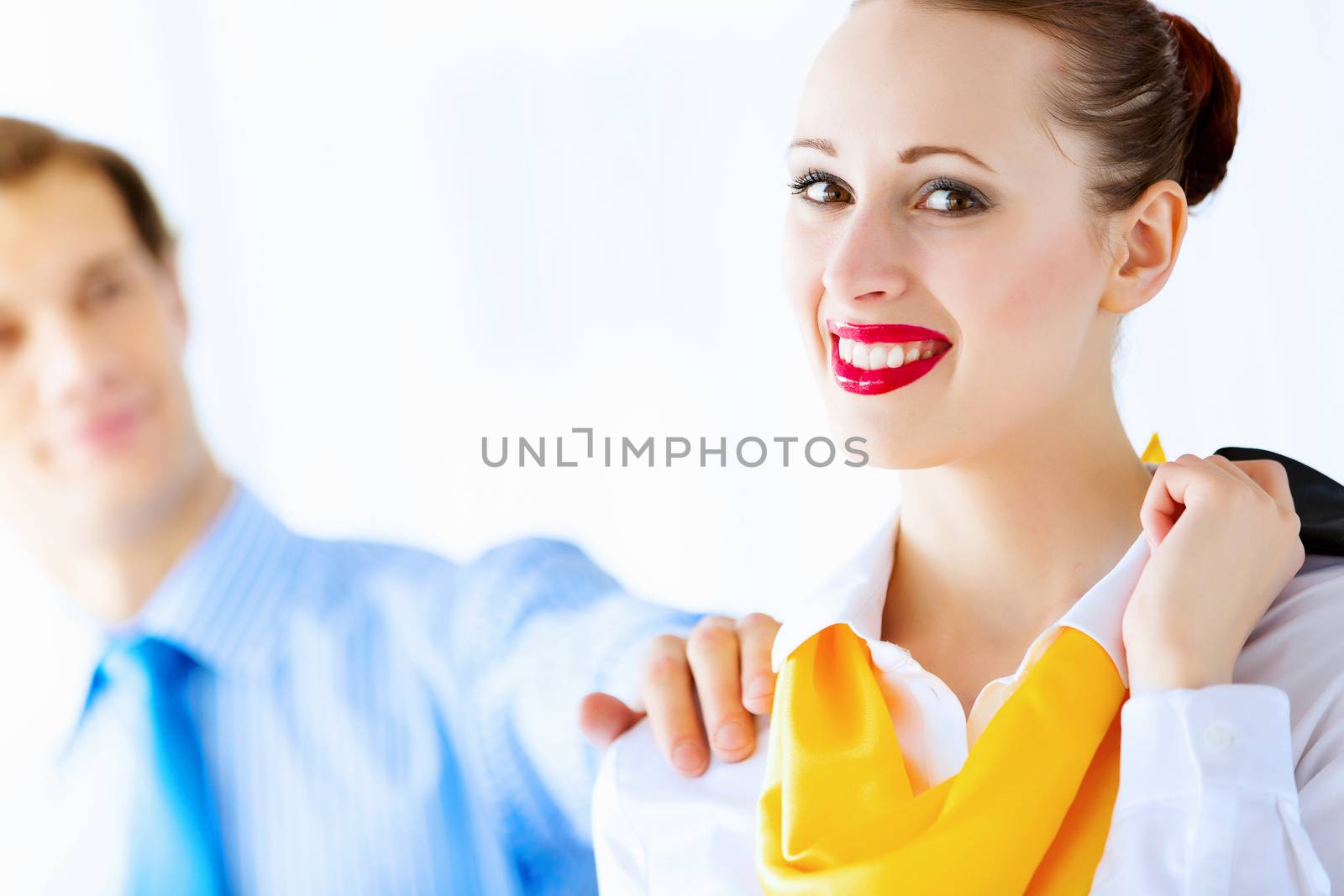 Image of businessman and businesswoman smiling joyfully