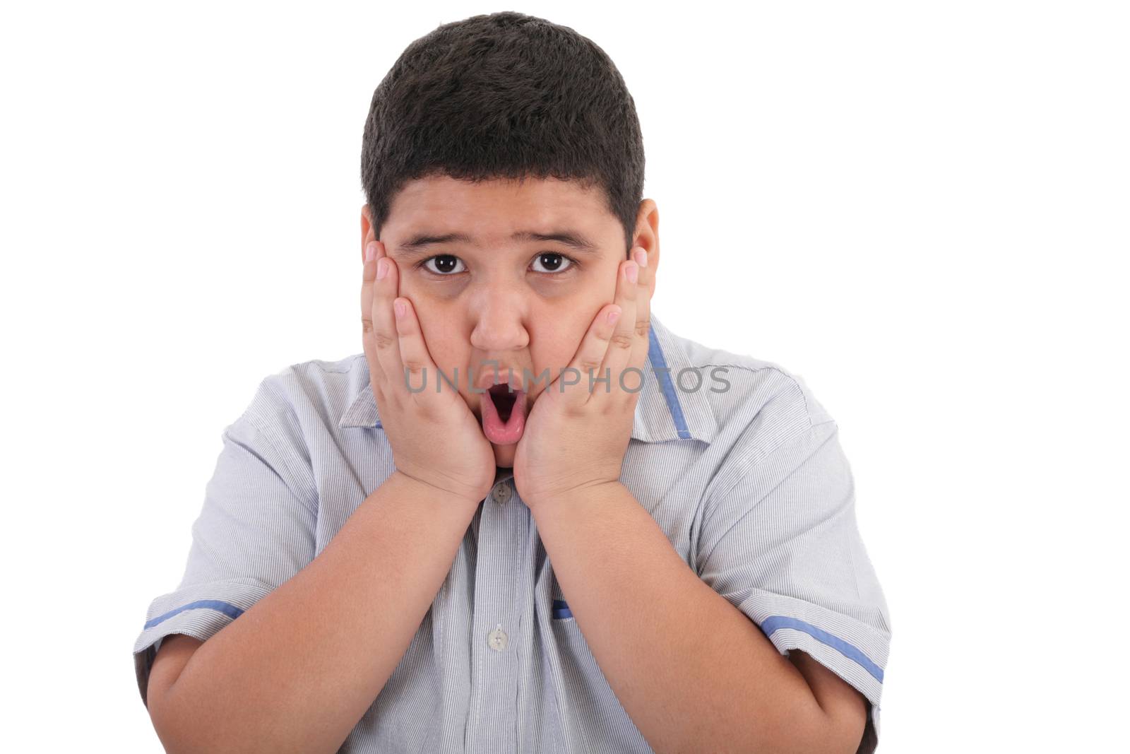 Scared litle kid boy holding hands on face and screaming isolated on white background