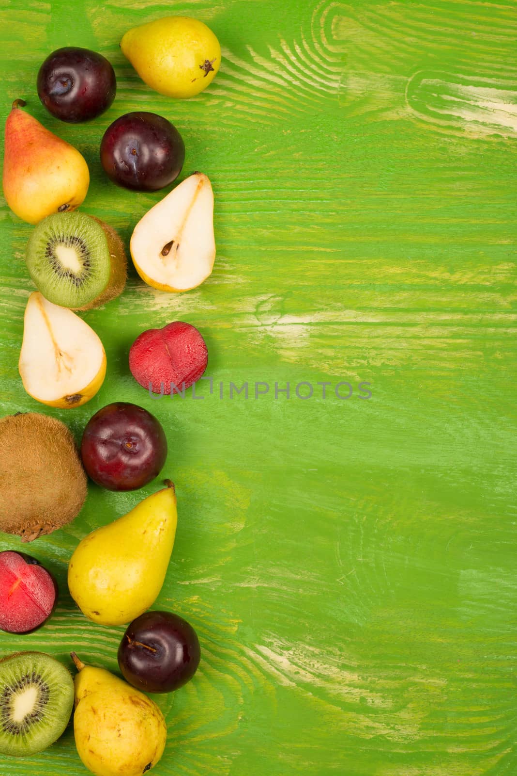 Fresh fruit arranged on a rustic background