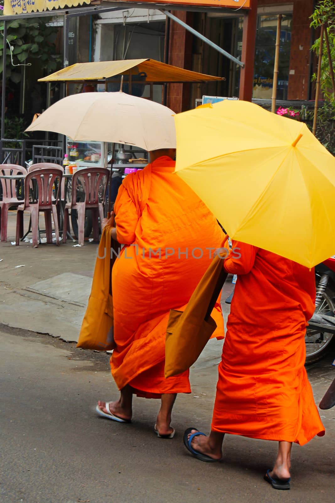 Buddist monks on the streets on Phnom Pen, Cambodia
