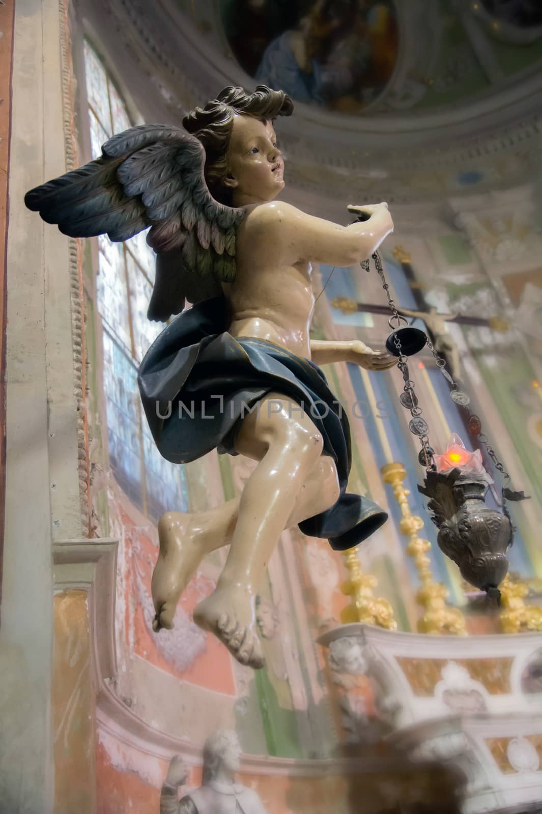 ancient wooden statue of an angel