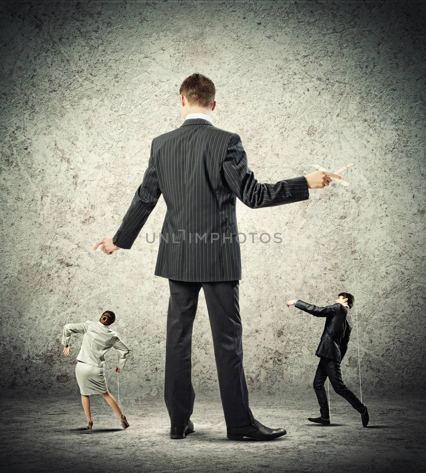 Image of young businessman puppeteer. Leadership concept