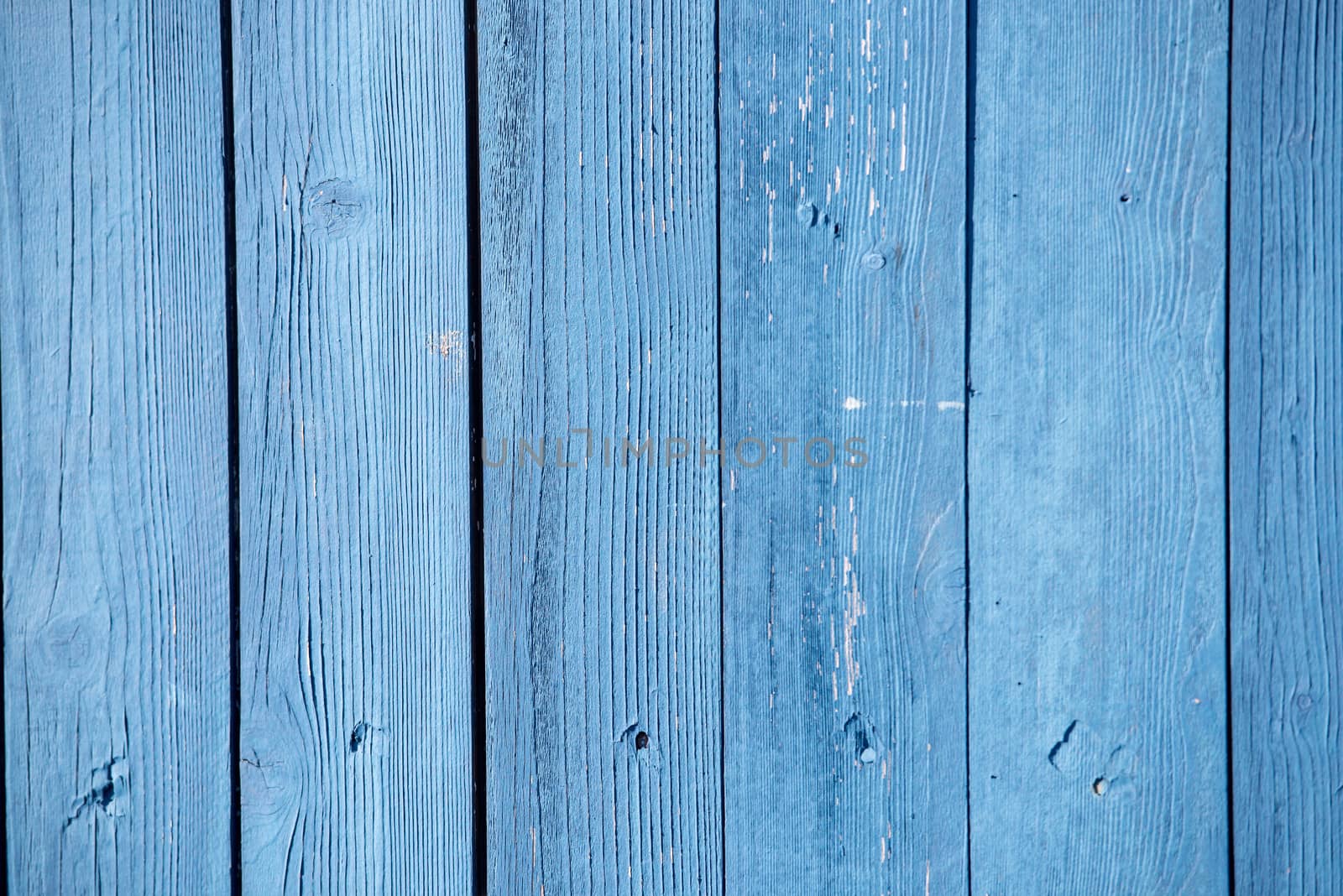 fence coated with a thin layer of blue