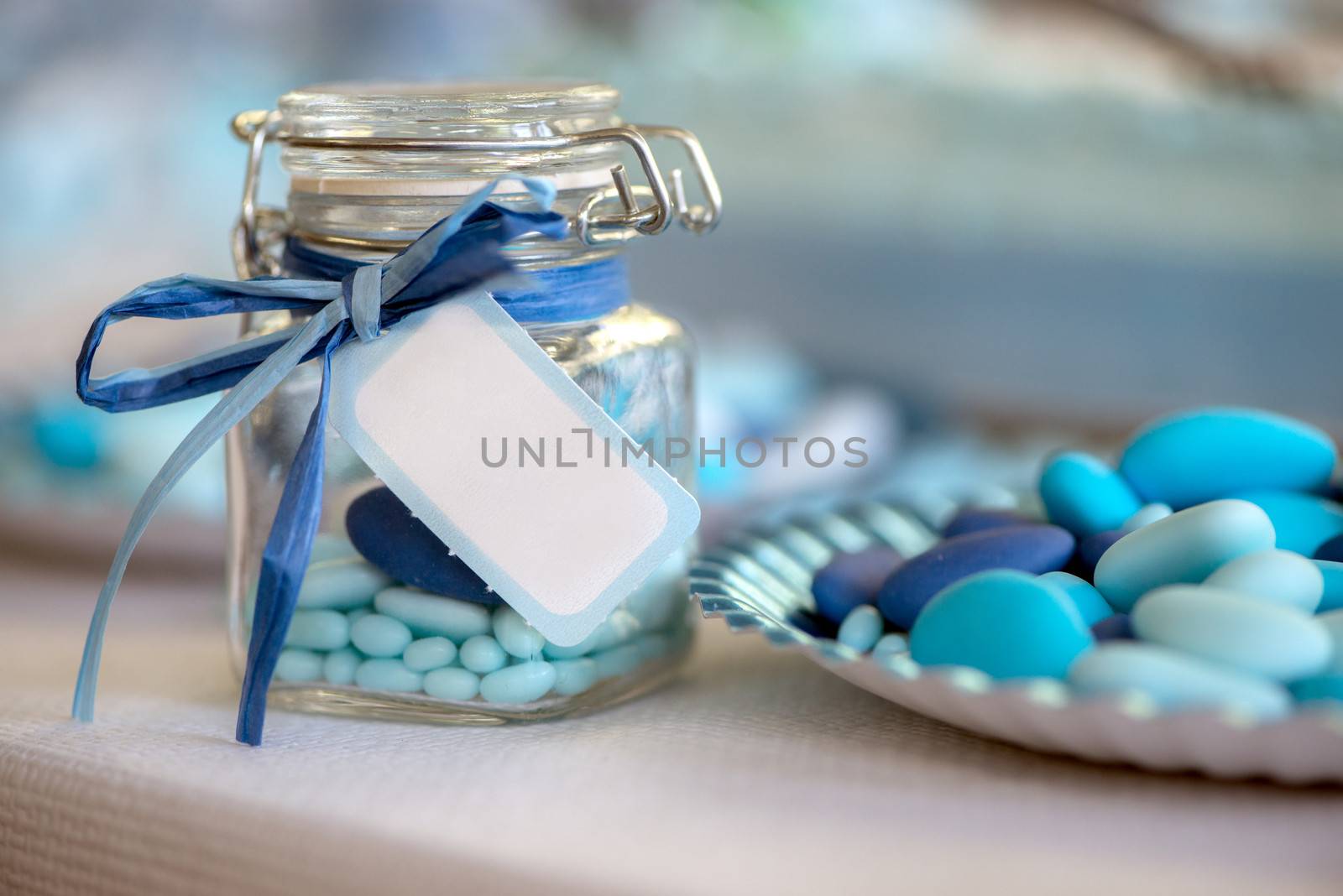 birth in light blue candy container glass and paper plate