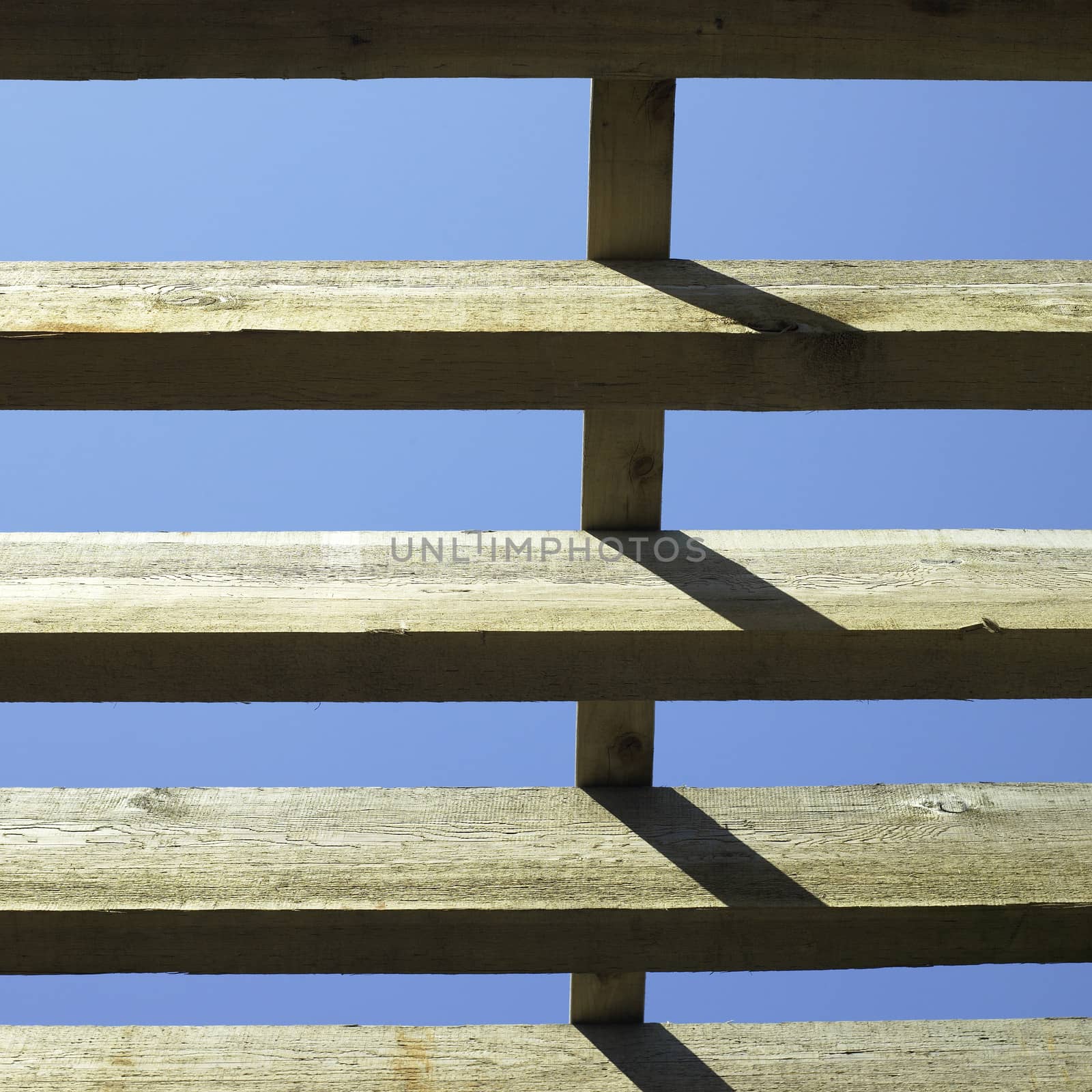 large wooden beams and blue sky