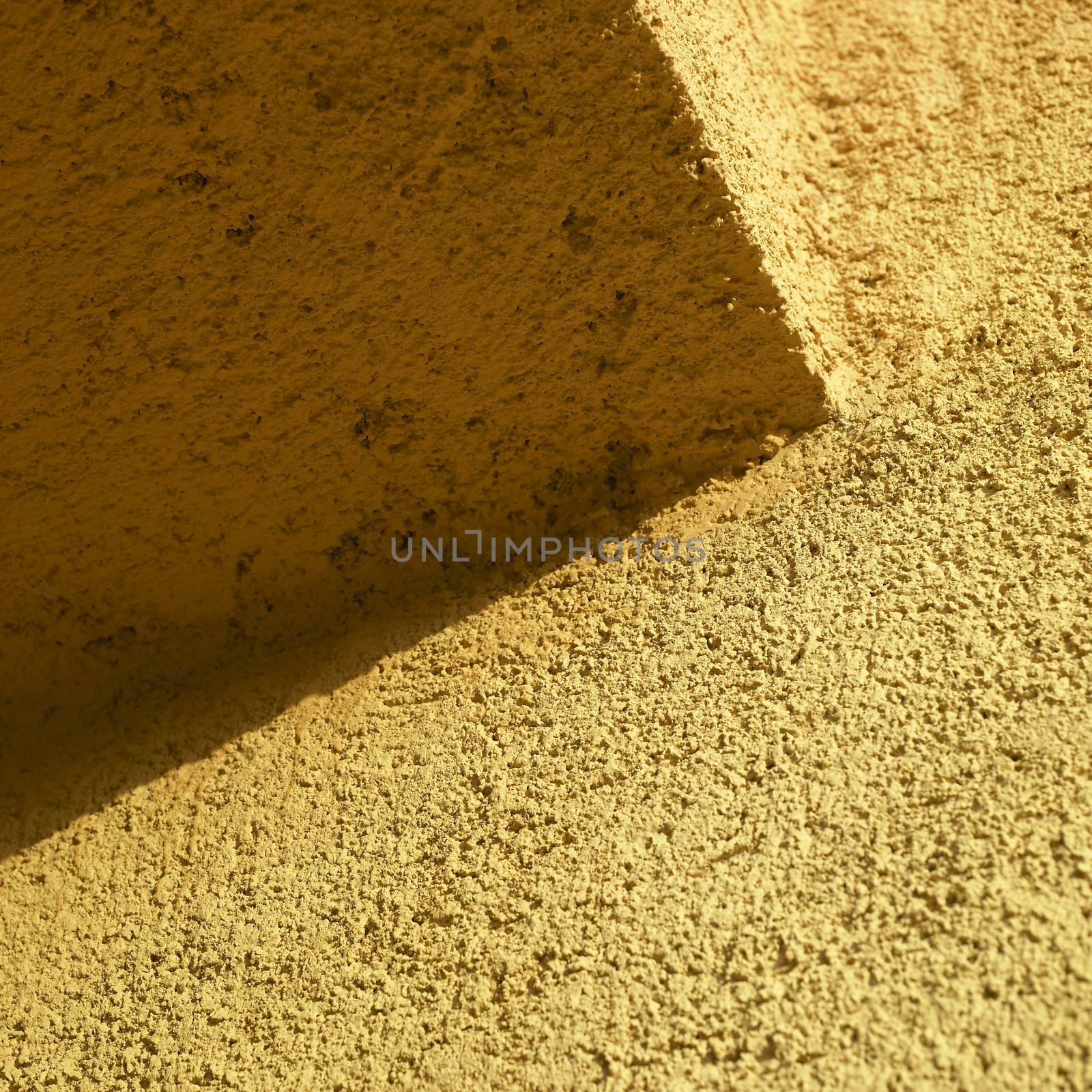 orange stucco wall close up