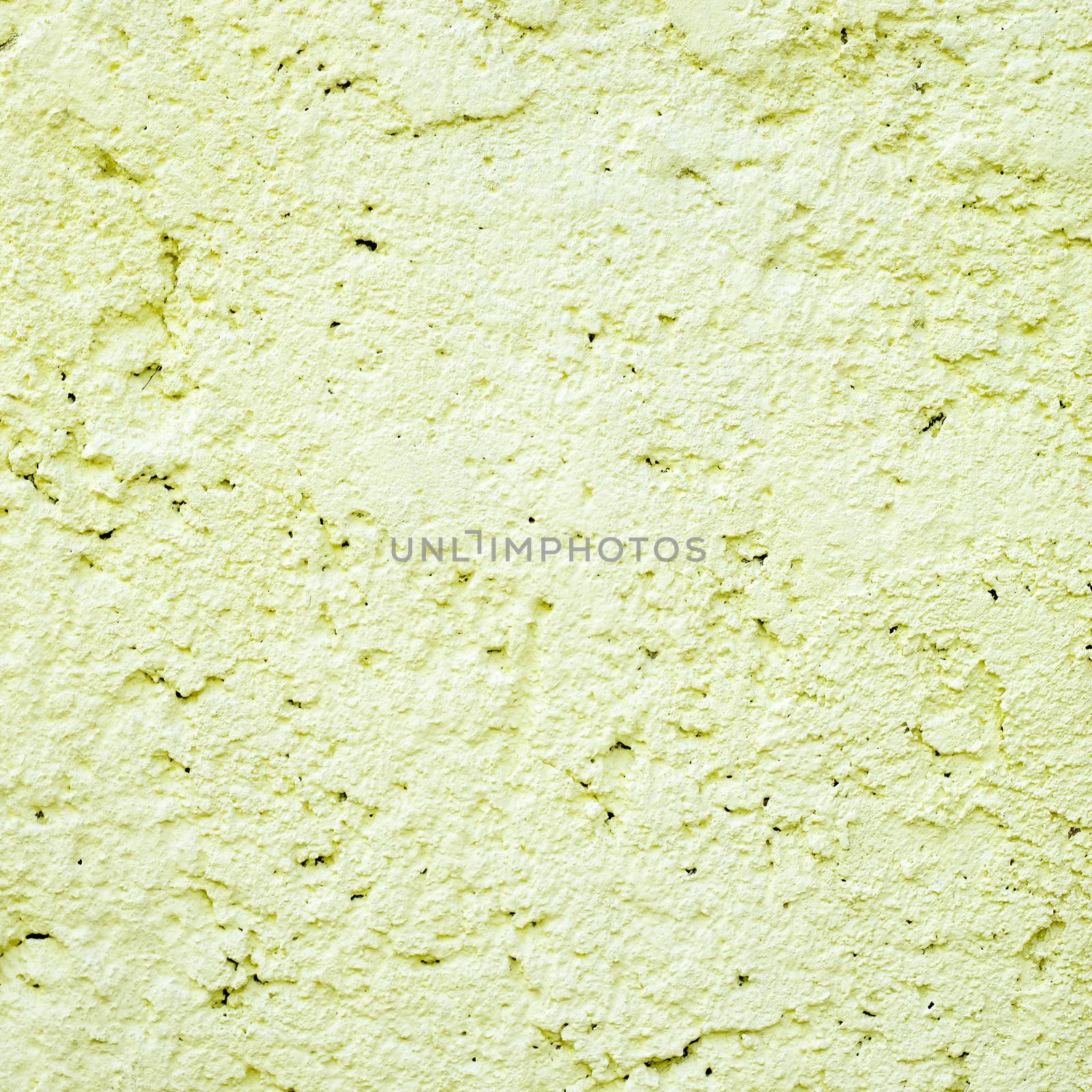 yellow stucco wall close up