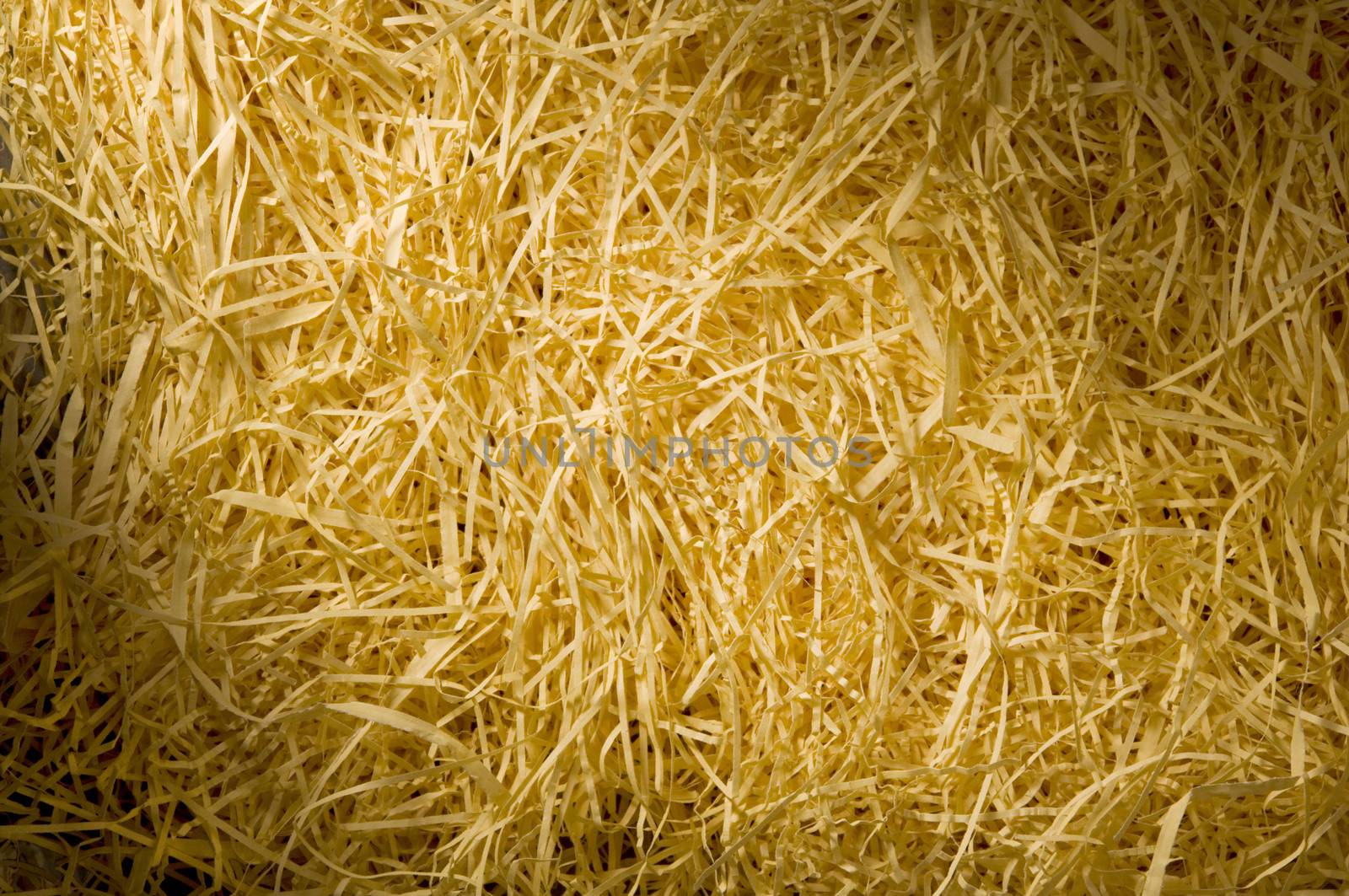 Yellow packing straw material lit diagonally by Balefire9