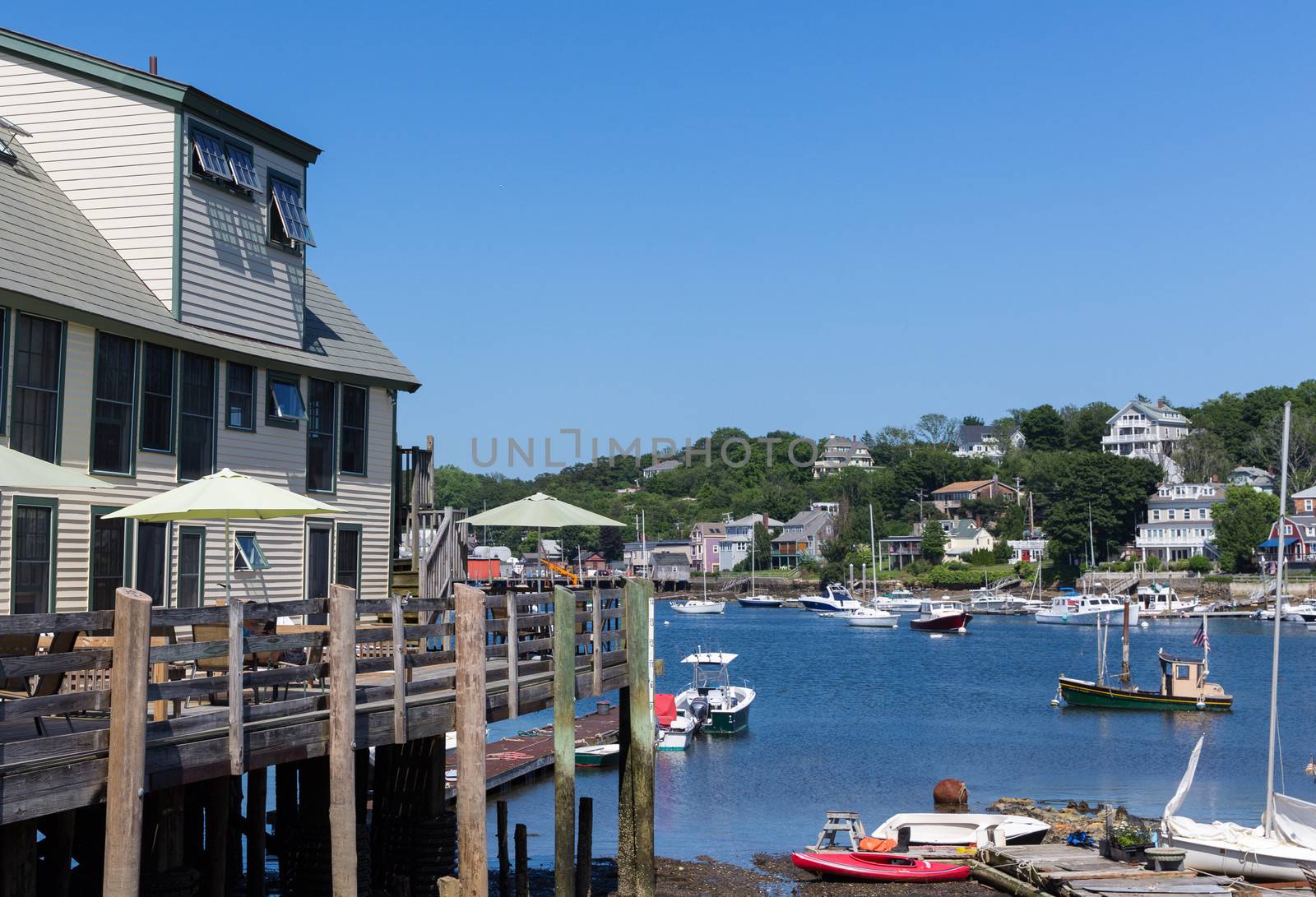 Tourist venues, homes, boats of all kinds are represented in this image of Rockport Harbor, MA