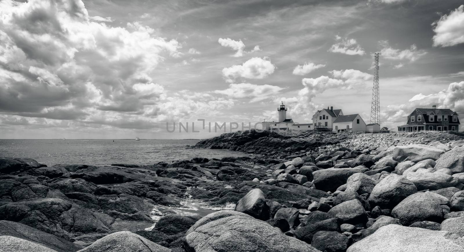 This is the Eastern Point Lighthouse sitting on a point of land extending from Gloucester Harbor in Massachuisetts.