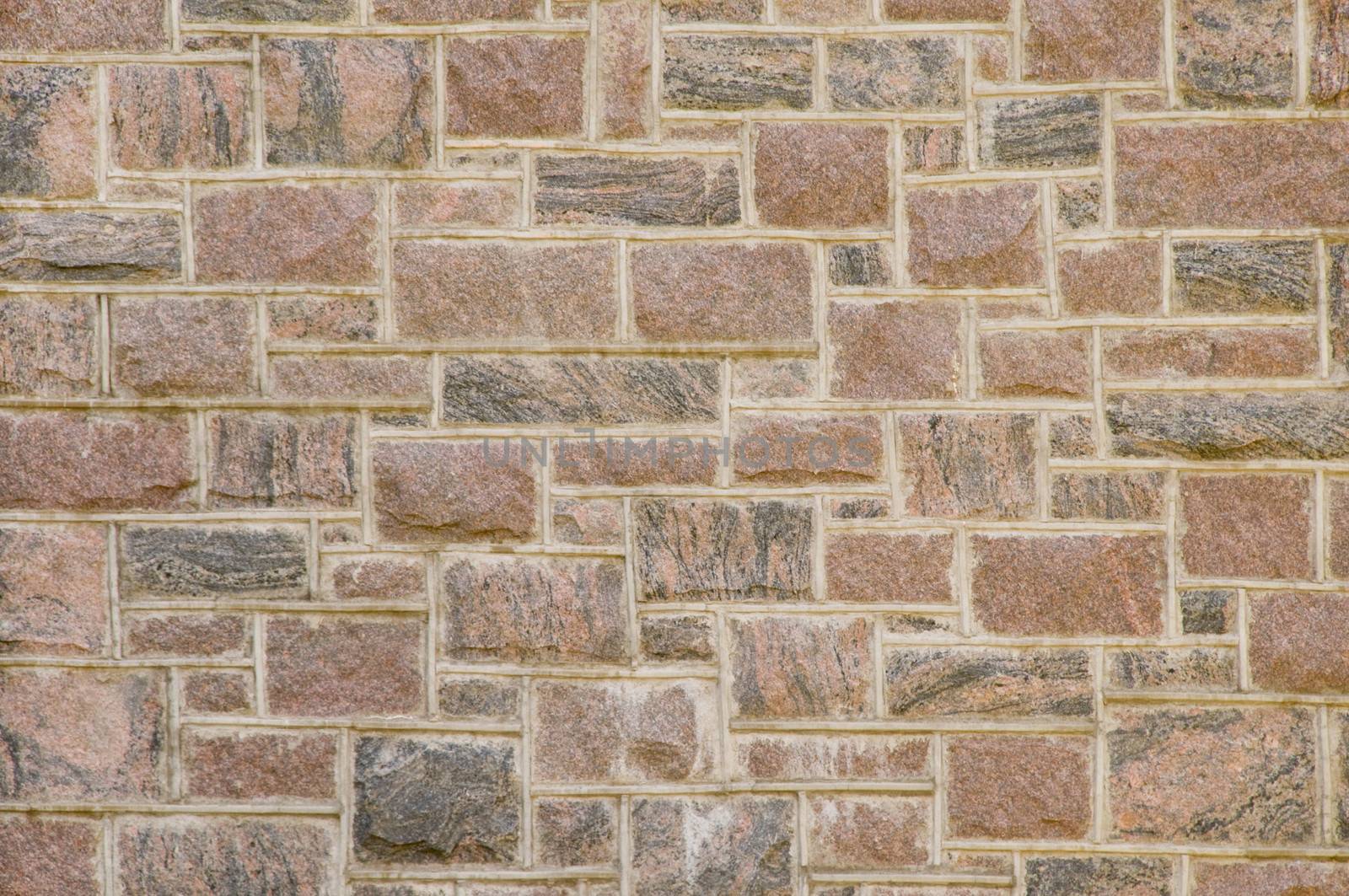 Black and reddish masonry block wall texture
