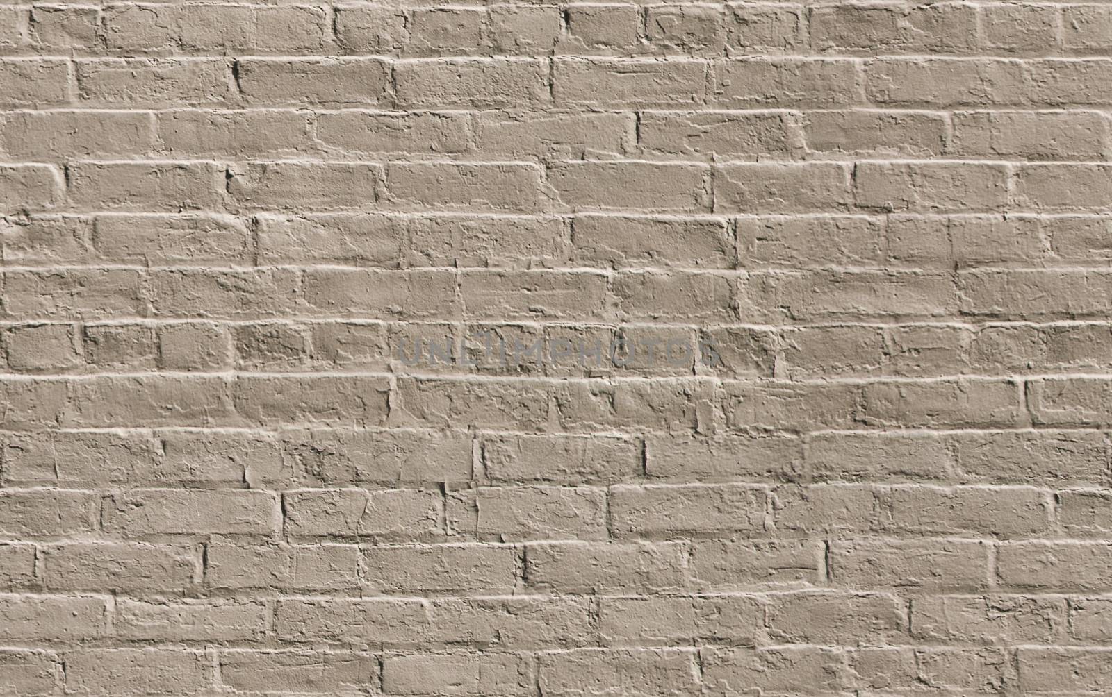 Beige painted brick wall seamlessly tileable background texture