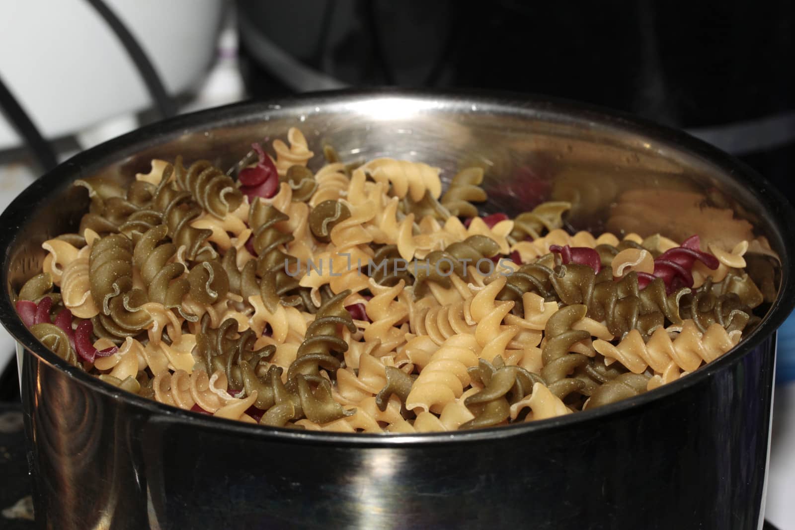 Spiral pasta cooking in a pot