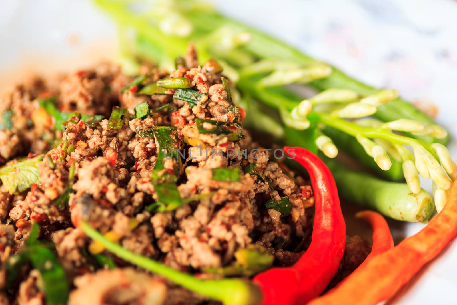 raw minced meat for thai food on a plate