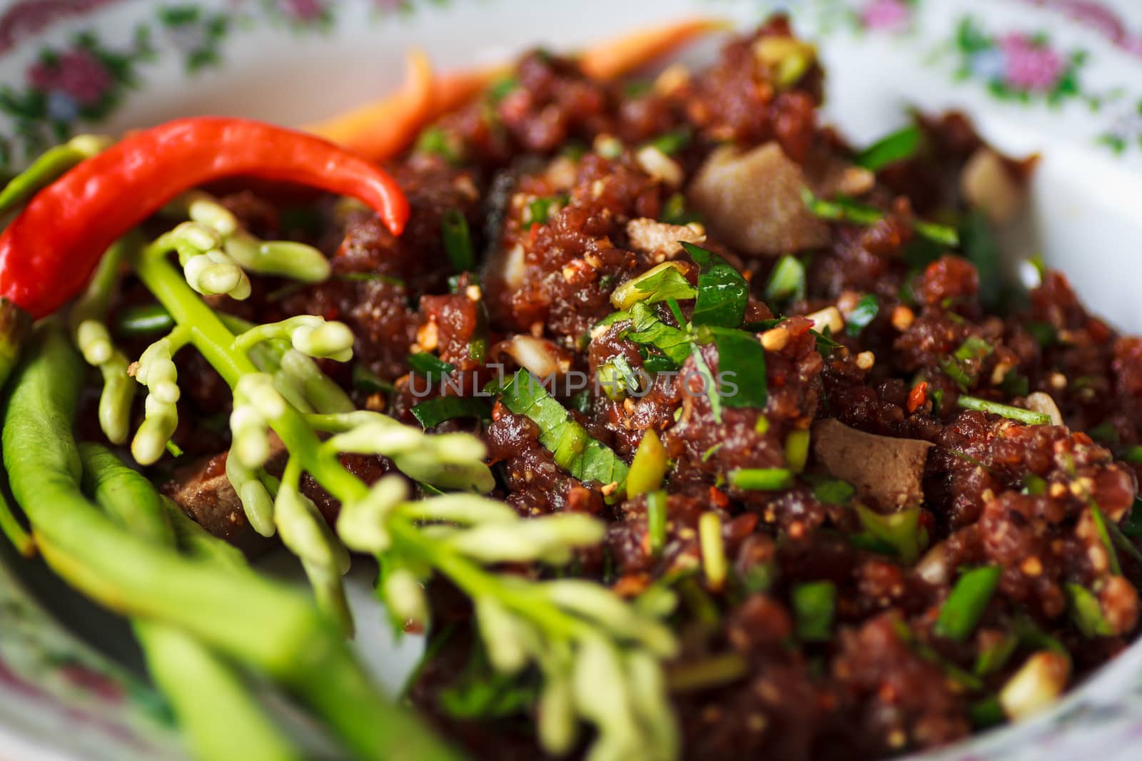 raw minced meat for thai food on a plate