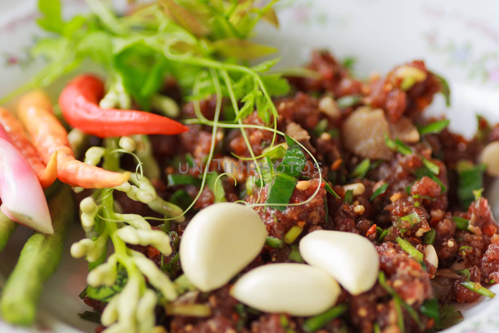 raw minced meat for thai food on a plate