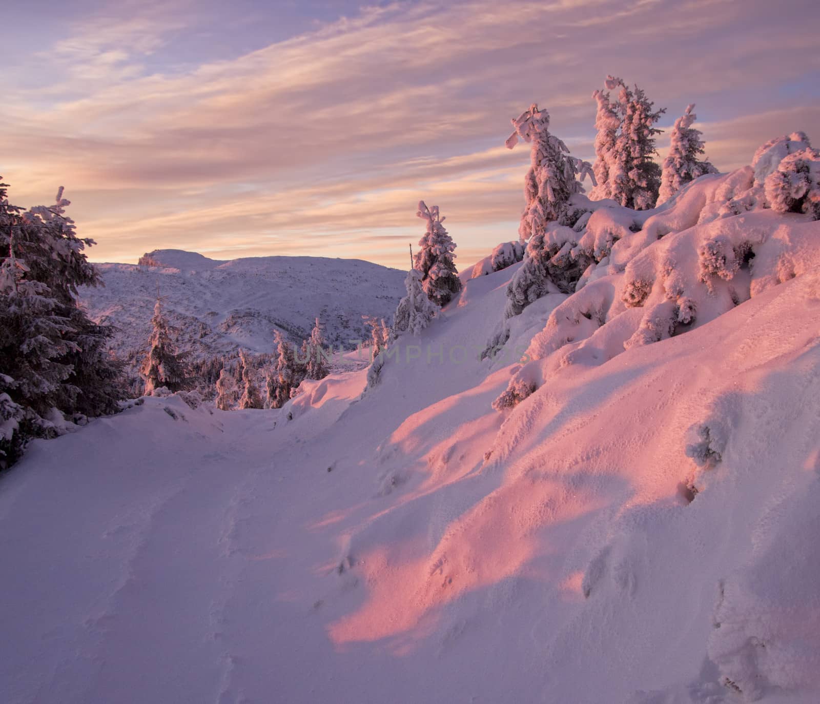 beautiful red winter mountain sunset in Romanian Carpathians