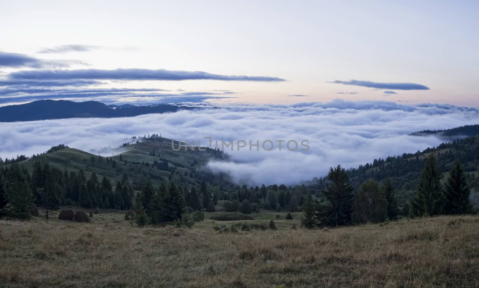 rural landscape with cloud mist under mountain scenery
