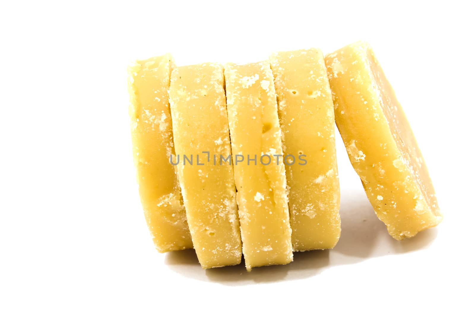 Brown sugar cane in white background.